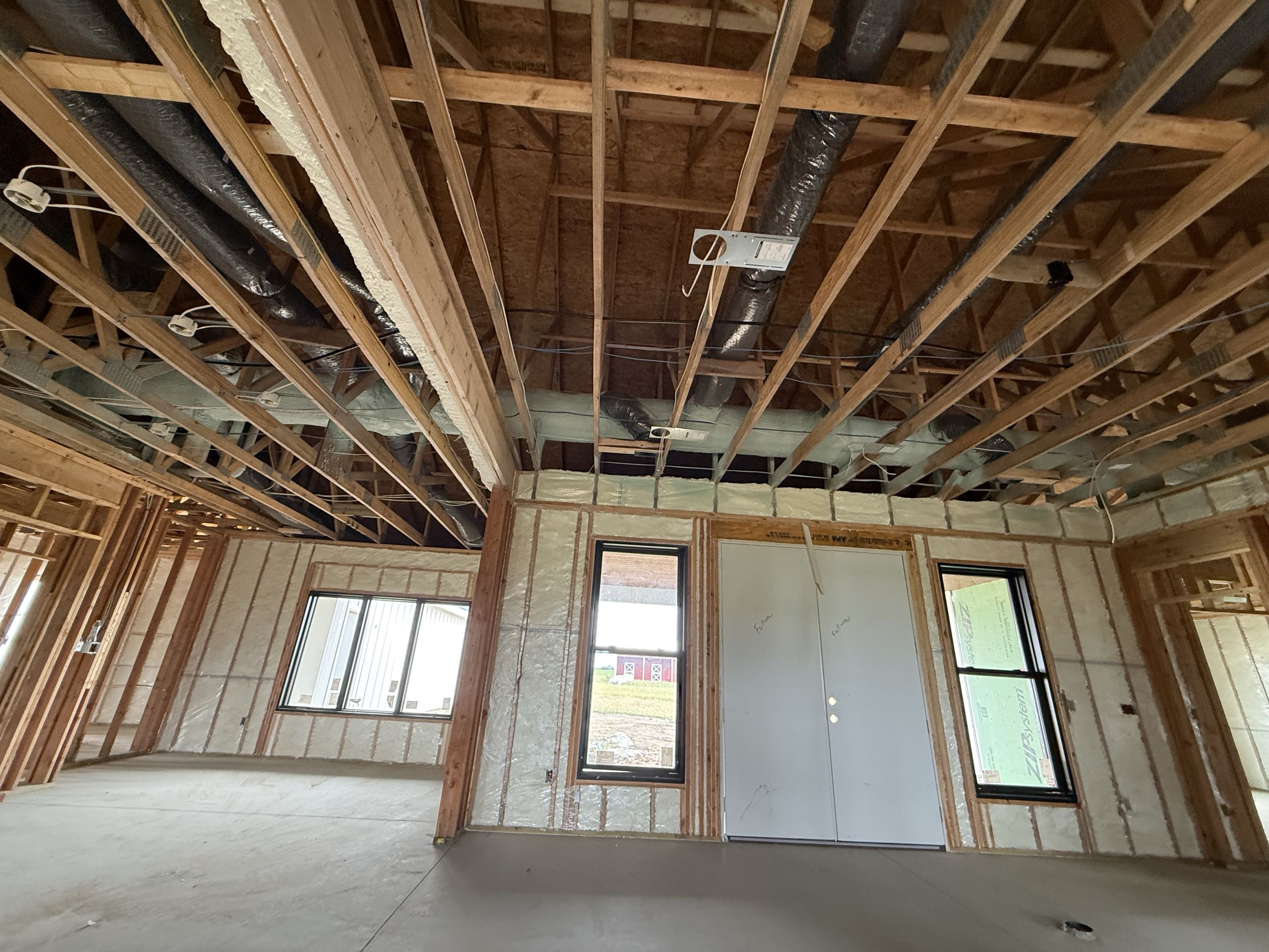 Wellsville, Kansas another new construction house insulated. Pro fill open cell with 2 inches of closed cell on the ductwork in the attic.