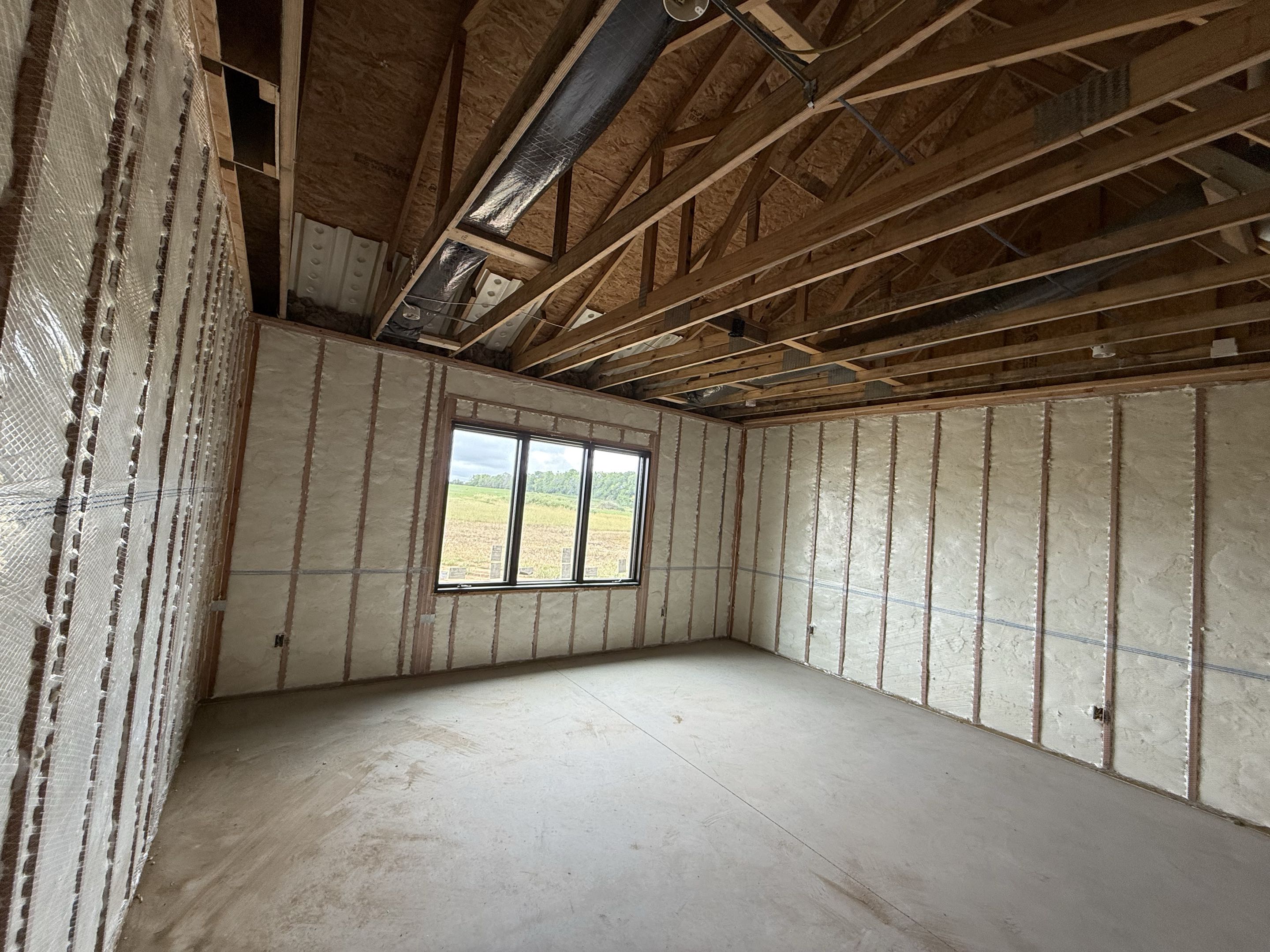 Wellsville, Kansas another new construction house insulated. Pro fill open cell with 2 inches of closed cell on the ductwork in the attic.