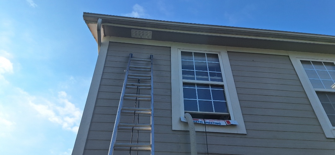 Installing soffit vents for proper ventilation and ducting bath fans to prevent mold in Gardener KS