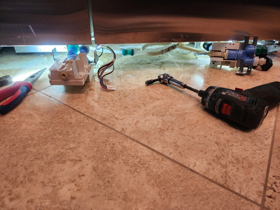 A KitchenAid built-in refrigerator was experiencing a water leak through the dispenser. Upon inspection, it was determined that the water valve was weeping. The faulty water valve was replaced with a new one, ensuring a proper seal and preventing further leaks. The refrigerator was tested to confirm the issue was resolved, and the customer was satisfied with the repair. The appliance now functions as intended, with no signs of water leakage.