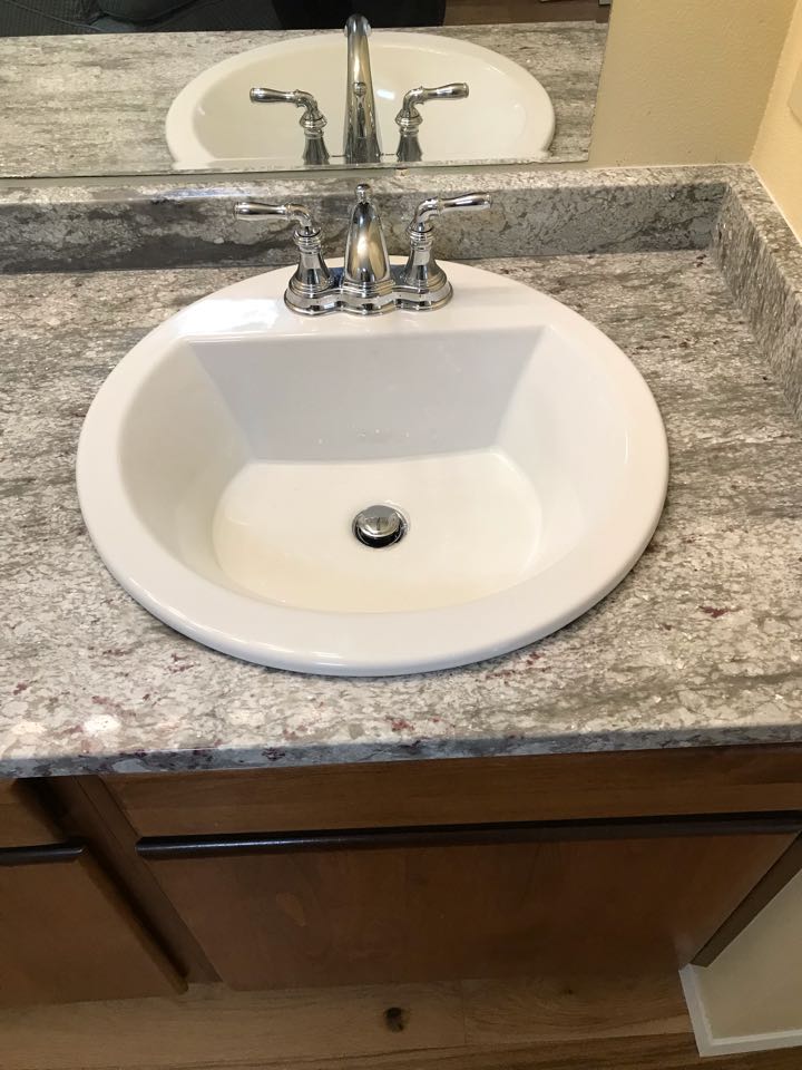 Installed side by side lavatory sinks and faucets. 