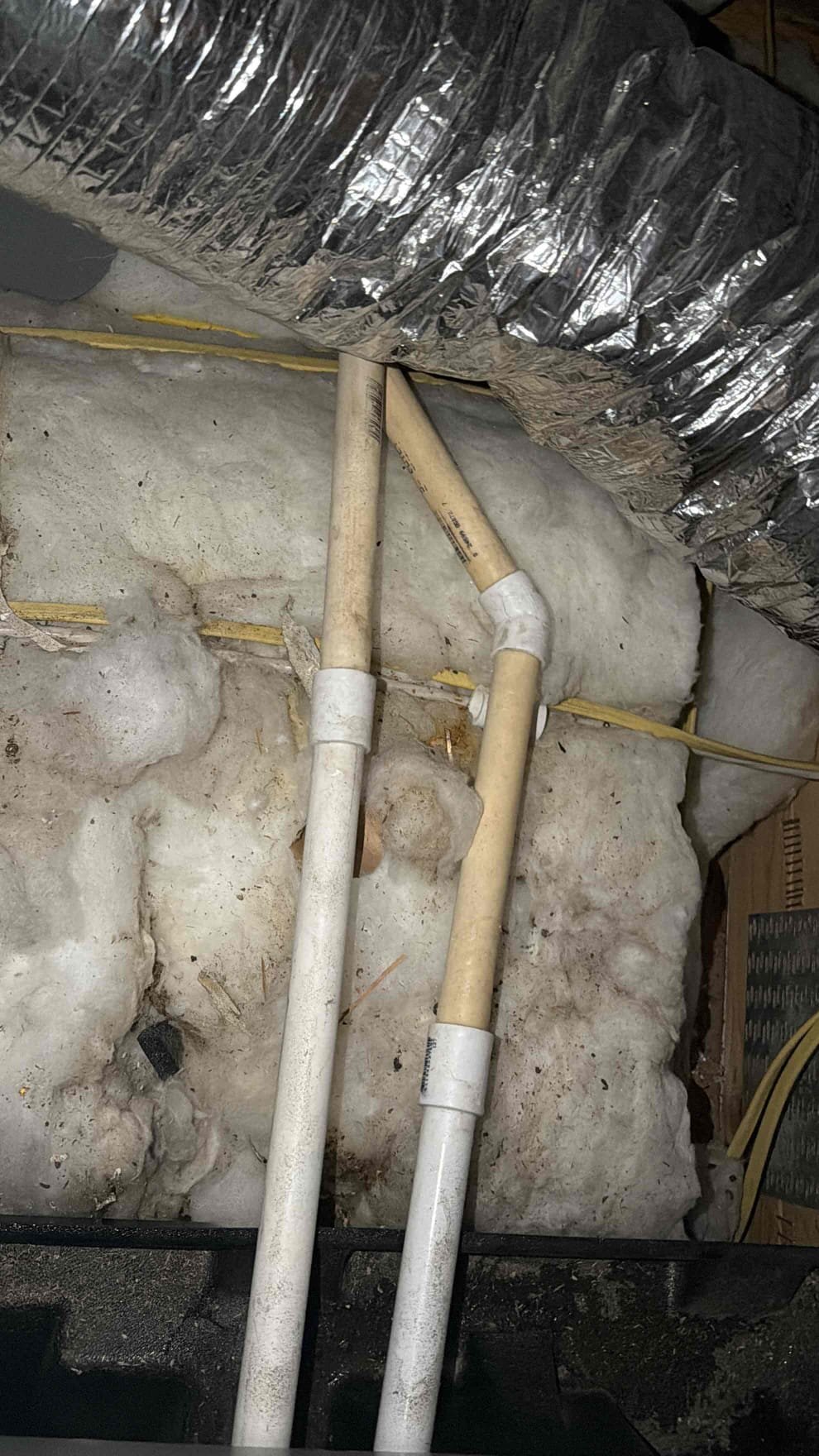 Upon arrival, the painter advised that on 9/7/26, he observed water coming from the ceiling. I accessed the attic and inspected the PVC 45° fitting and coupling to check for any leaks. I also checked that the fittings had glue and found that they were properly secured. As a precaution, I applied additional glue over the fittings. I also inspected the coil and applied additional tape around the coil to help prevent water from leaking. I checked the insulation and found it to be slightly wet. After completing the inspection, I confirmed that the unit was no longer leaking.