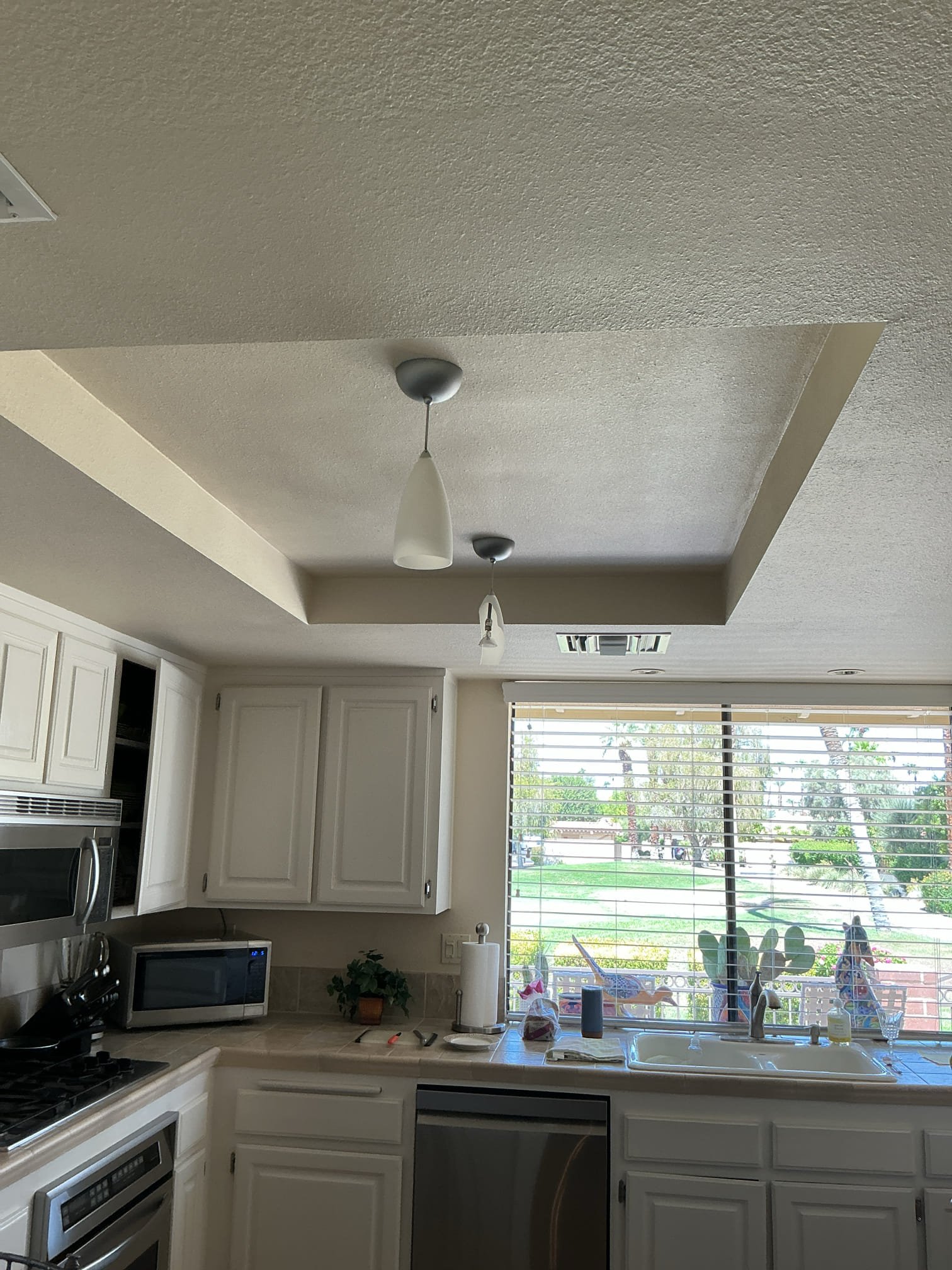 Arrived to remove 2 kitchen light fixtures and install 2 customer supplied kitchen light fixtures.