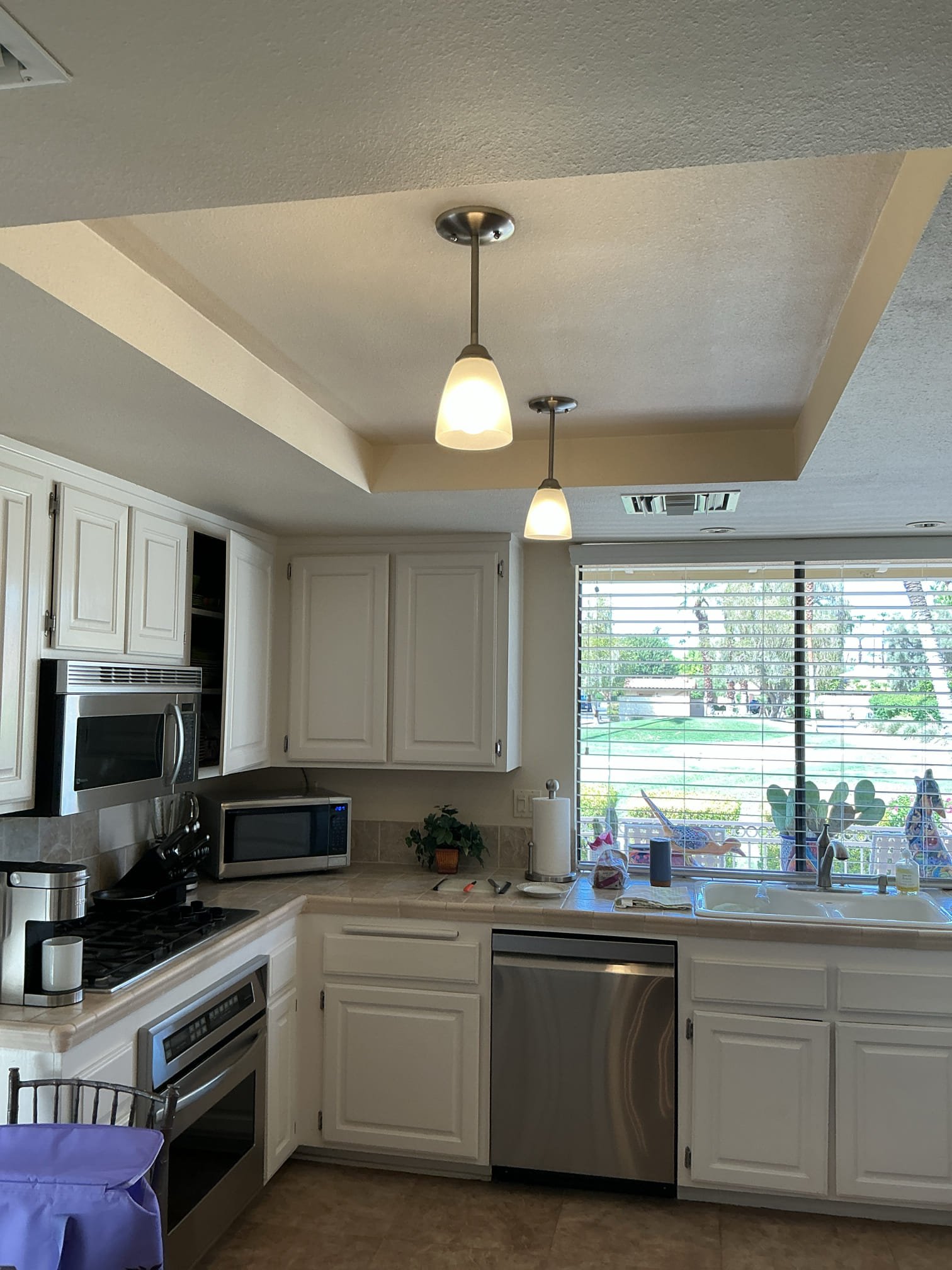 Arrived to remove 2 kitchen light fixtures and install 2 customer supplied kitchen light fixtures.