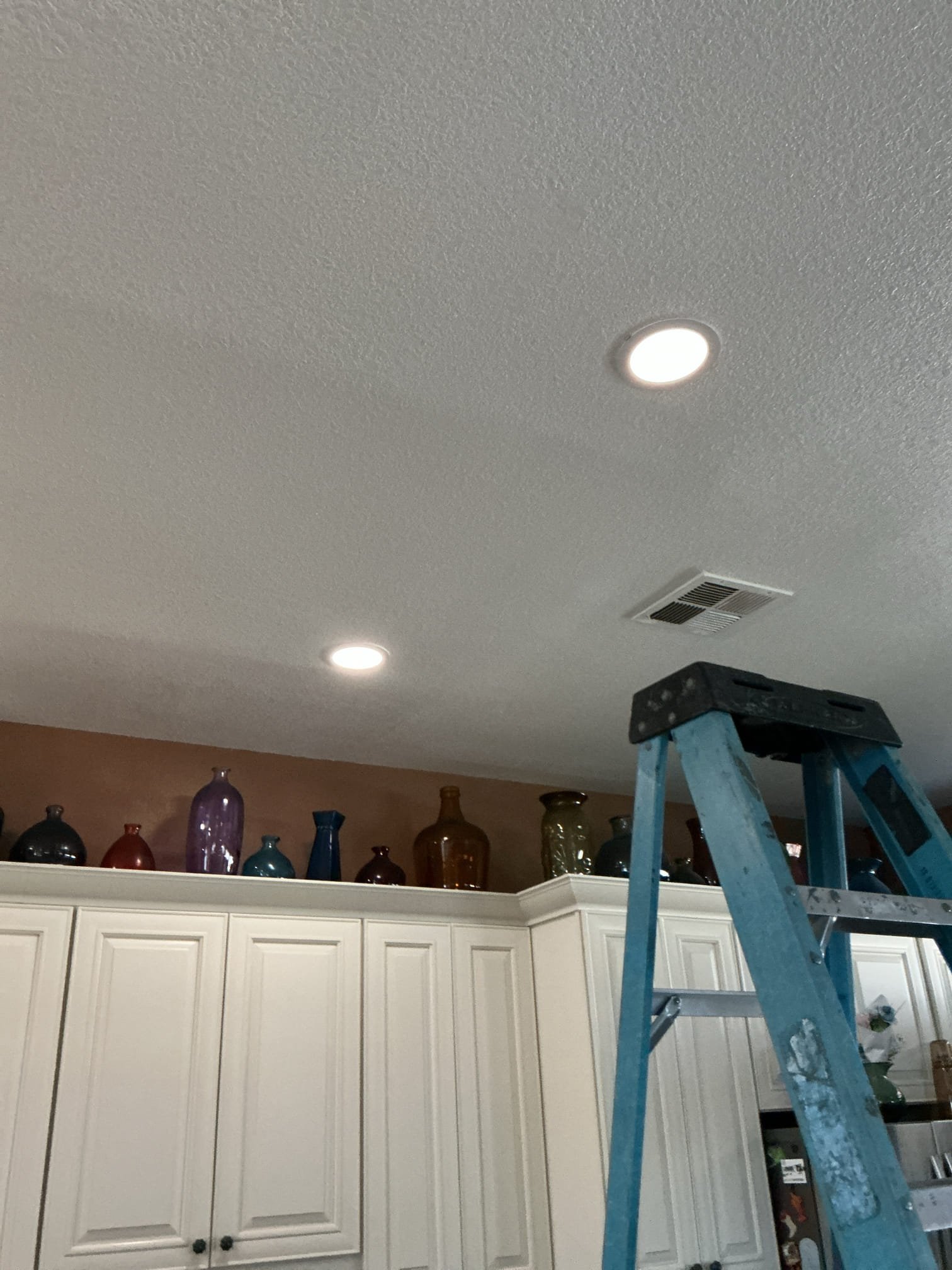 Arrived to adjust a canless light that we previously installed. The light has settings on it that changes the color of the light when dimmed. I turned off the feature and light is now working properly.