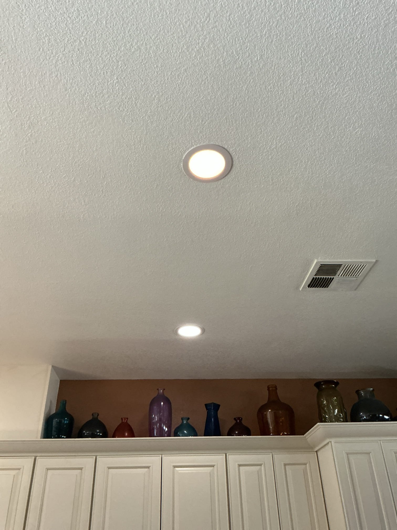 Arrived to adjust a canless light that we previously installed. The light has settings on it that changes the color of the light when dimmed. I turned off the feature and light is now working properly.