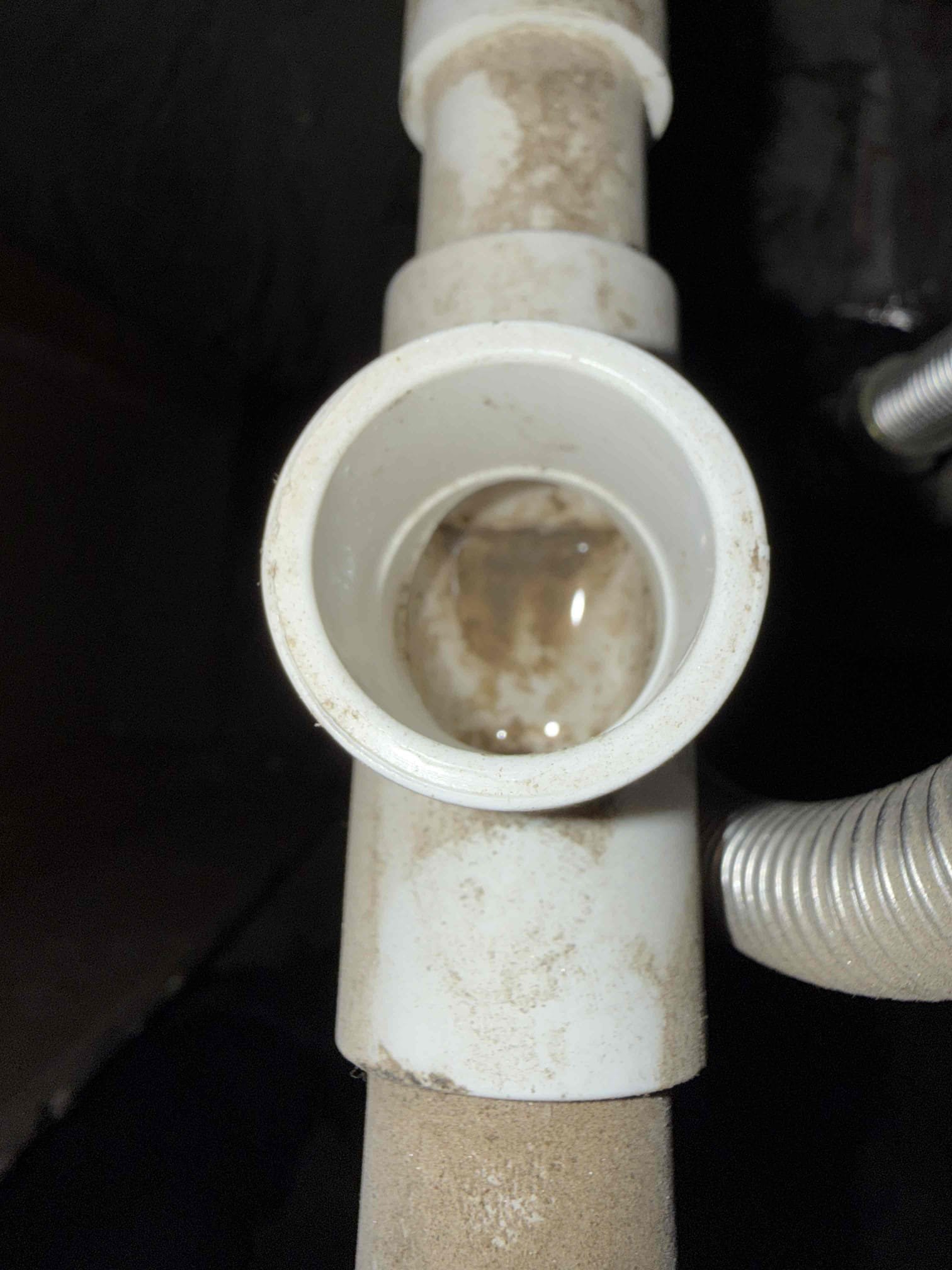 Condensate drain backed up but vent on drain line was dry. Lightly blew pressurized air to coil to clear any blockages before jones valve, after that it all came pouring out in large amount. Blockage was at evaporator coil ports for condensation drains so jones valve clearing would clear rest of drain but not blockage before that, may want to lightly blow very light air pressure to coil direction on maintenance to make sure it’s clear before and after jones valve. Dried up all accessible wet spots either clean rags and shop vac. Observed condensation draining out towards termination now. 