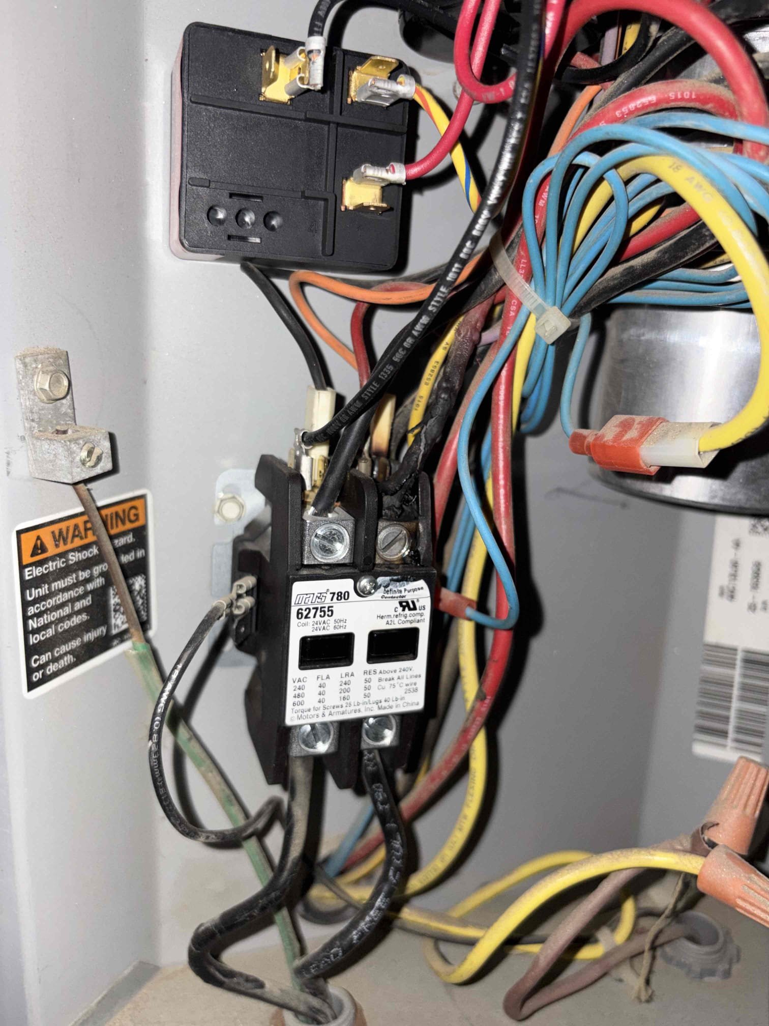 Contactor, burnt and wires burnt as well replace contactor as a warranty part because it was just replaced in July after replacing contactor pressures checked out system checked out and checked out in the correct range. Capacitor Checked out System is cooling and thermostat is properly operating at this time of service.