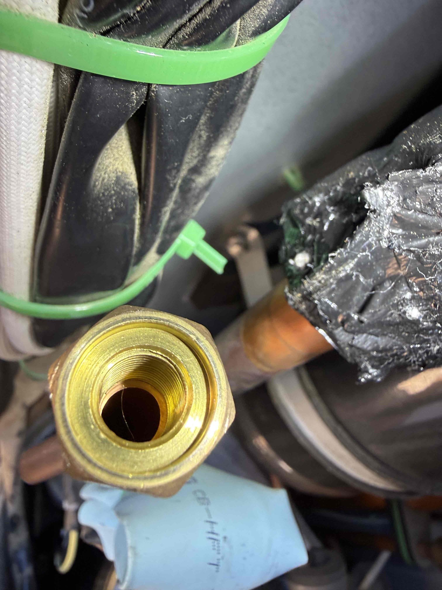 Cur off factory charge port. (Not needed) and braze shut, then add back full charge of 14 lbs. 

Performed repair, pressure tested, passed. Pulled vacuum and deed back factory charge. System is cooling properly now with 21° split. 2-year repair on where we brazed.
