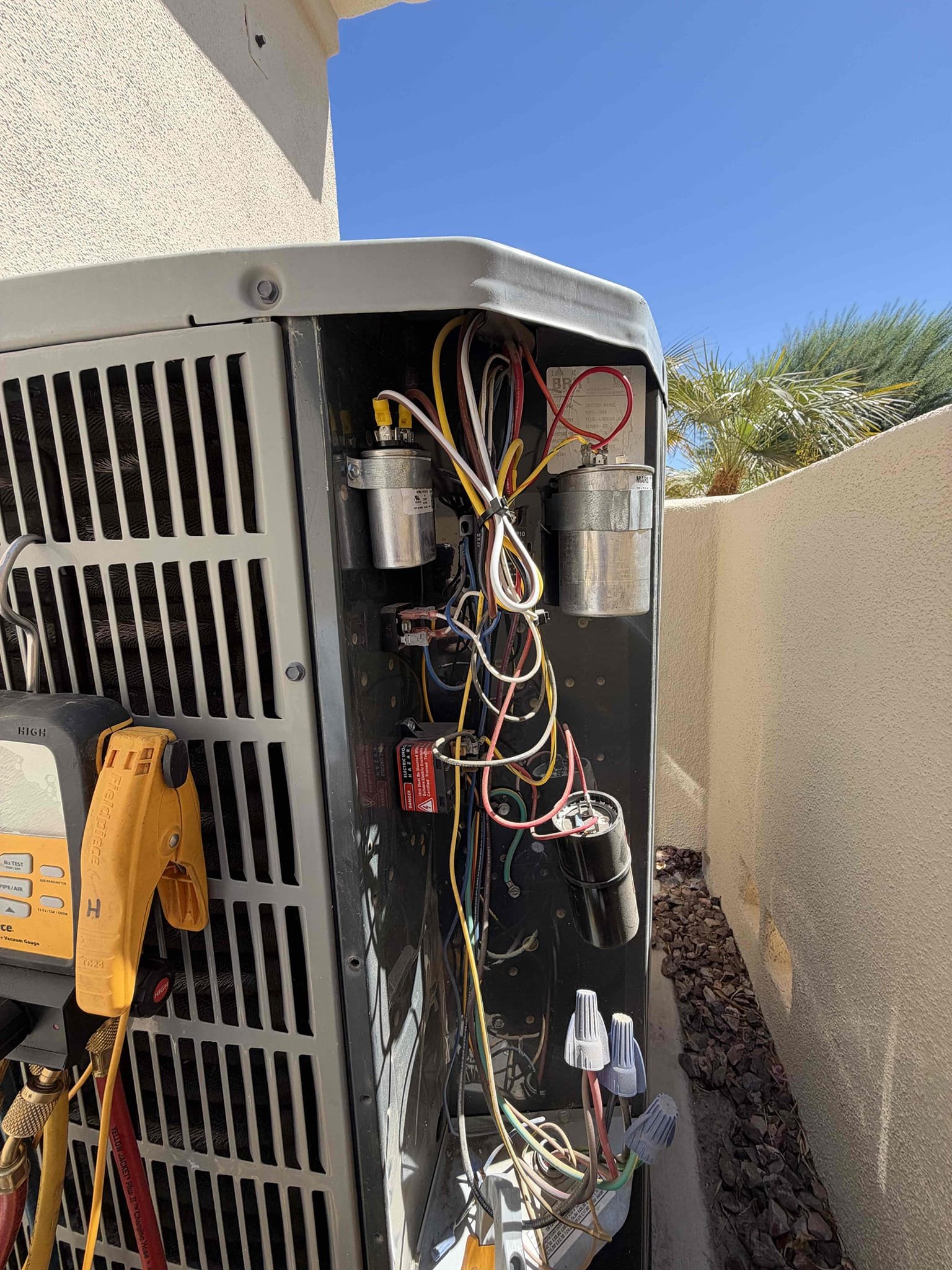 Maintenance on an American Standard gold series 4 ton upflow split system. FAU located in garage 20 x 25 filter at FAU. Condensation line cleared filter changed. American Standard thermostat working properly. Perform maintenance on mini split in Casita. Check system sequence of operation. Check compressor amps, check fan motor amps, check capacitor, check compressor saver, check Freon and pressure, check fuses and disconnect box, check pressure switch, check inducer motor, check 24 V on gas valve, check flame sensor and igniter, check temperature. Upon maintenance inrush above manufacture spec. Compressor kit no longer good notify client recommend replace. Client agreed and signed estimate. Install new compressor saver kit. Showed client the results. System is working per manufacture spec.