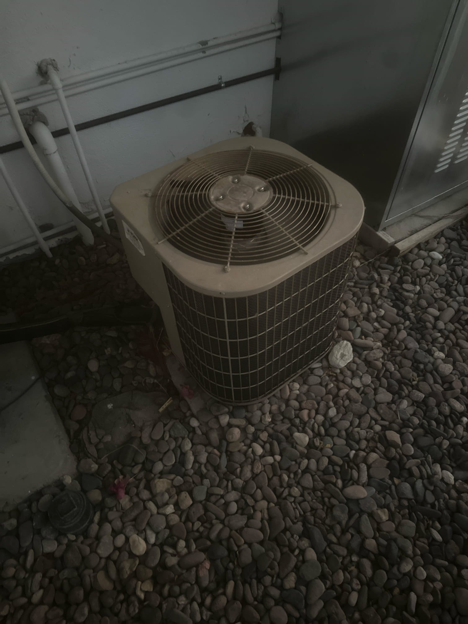 Demand Call – Package Unit Not Operating
Equipment Information
Manufacturer: International Comfort Products (ICP)
Model: PGD336060K001C1
Serial Number: C132409946
Year: 2013
Refrigerant: R-410A
Diagnostic Findings
Upon arrival, the member stated that the equipment was not operating. During inspection, multiple issues were discovered.
Found equipment wiring disconnected. Reconnected and reconfigured wiring to restore operation and allow further diagnosis.
Further inspection revealed that the indoor blower motor and housing were not properly secured to the equipment frame. The blower motor capacitor was also found hanging unsecured.
The blower motor was found to be seizing, and the blower wheel fins were loose and damaged. The condition of the blower assembly may be related to the housing not being properly secured to the equipment frame.
The equipment had also previously required additional refrigerant, indicating a possible refrigerant leak within the system.
Recommendations and Member