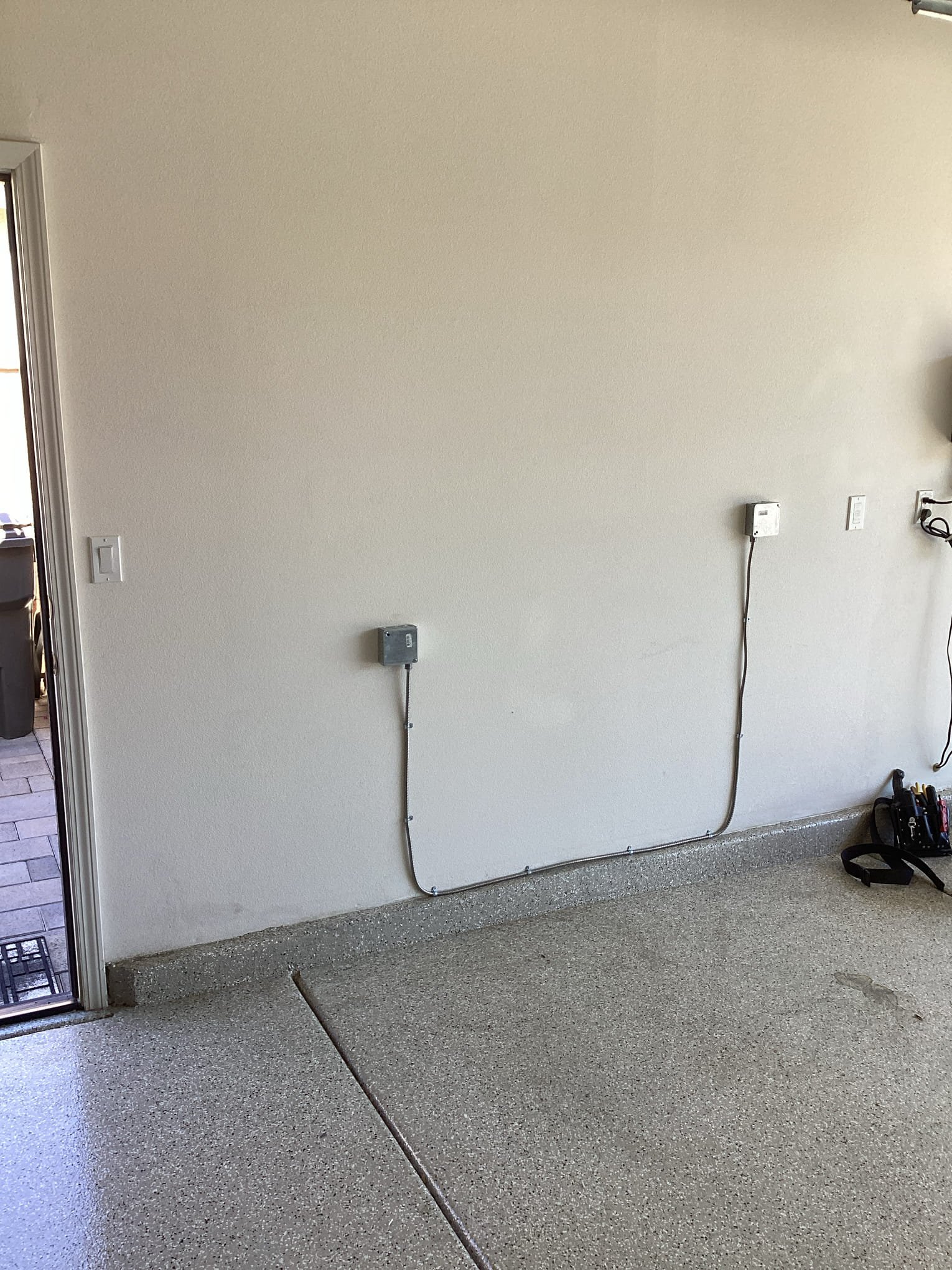 Arrived at customer’s home to install a new dedicated 240 v 20 amp circuit for minisplit that is being installed today. Used existing conduit to box in garage, from there we ran mc cable to disconnect location on exterior of garage. Landed all connections and tested power to verify proper operation and confirmed electrical work with customer to complete scope of work for today.