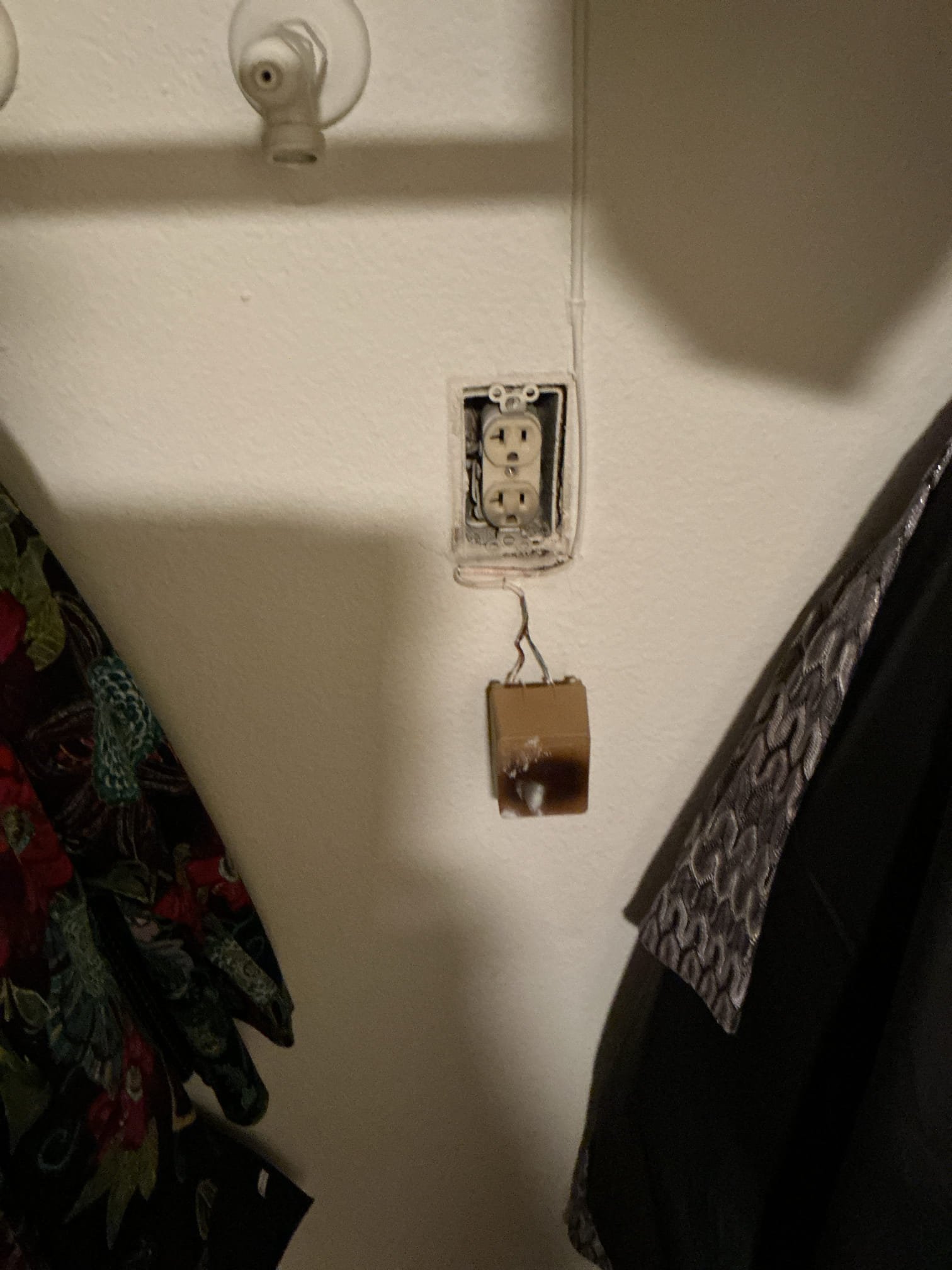 Arrived to inspect and replace outlet in hallway closet that was burnt due to alarm plug transformer overheating.
