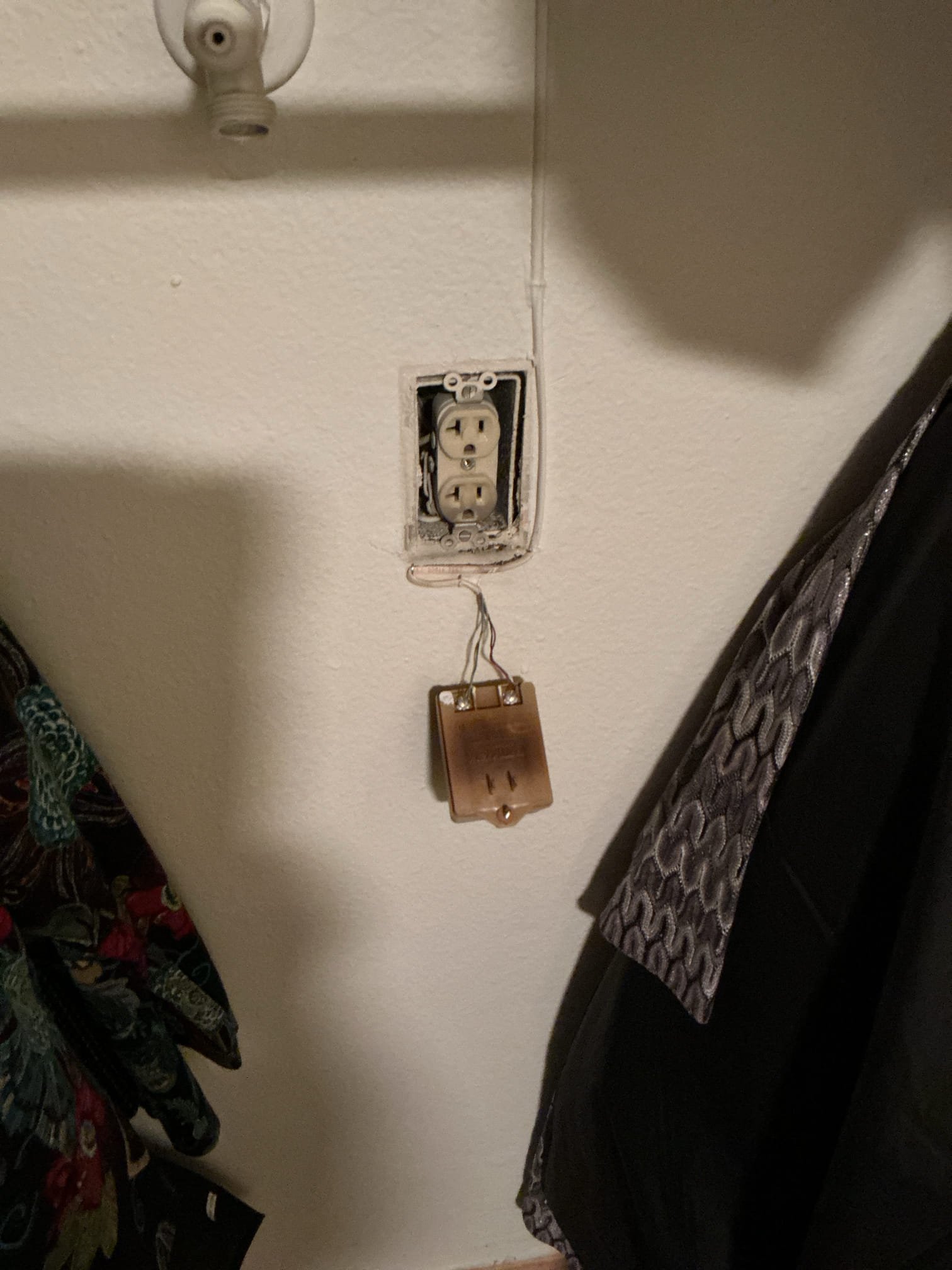 Arrived to inspect and replace outlet in hallway closet that was burnt due to alarm plug transformer overheating.