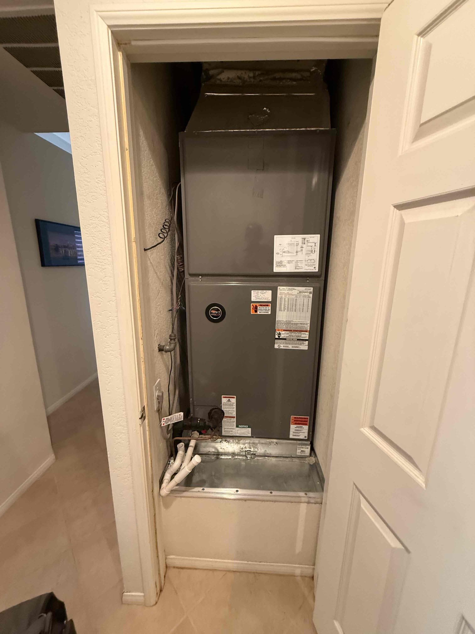 Performed indoor unit/heating maintenance on 2020 Ruud split system heat pump. Indoor unit/air handler in inside closet. Replaced 20x25 filter at fau filter rack. Cleared condensation drain. Homeowner noticed closet door not closing fully, slight water damage to trim. Opened vent cap and backed up condensation was there. Cleared condensation drains and recommended getting a water safety switch and jones valve to help better prevent water damage from backed up drains again. Checked ECM blower motor amps. Wiring tight and secure. 30° heat rise. Termination point for drains in covered irrigation valve box. Made sure it was cleared there and enough room for riser to breathe. System is heating safely and properly at time of maintenance. Notes.