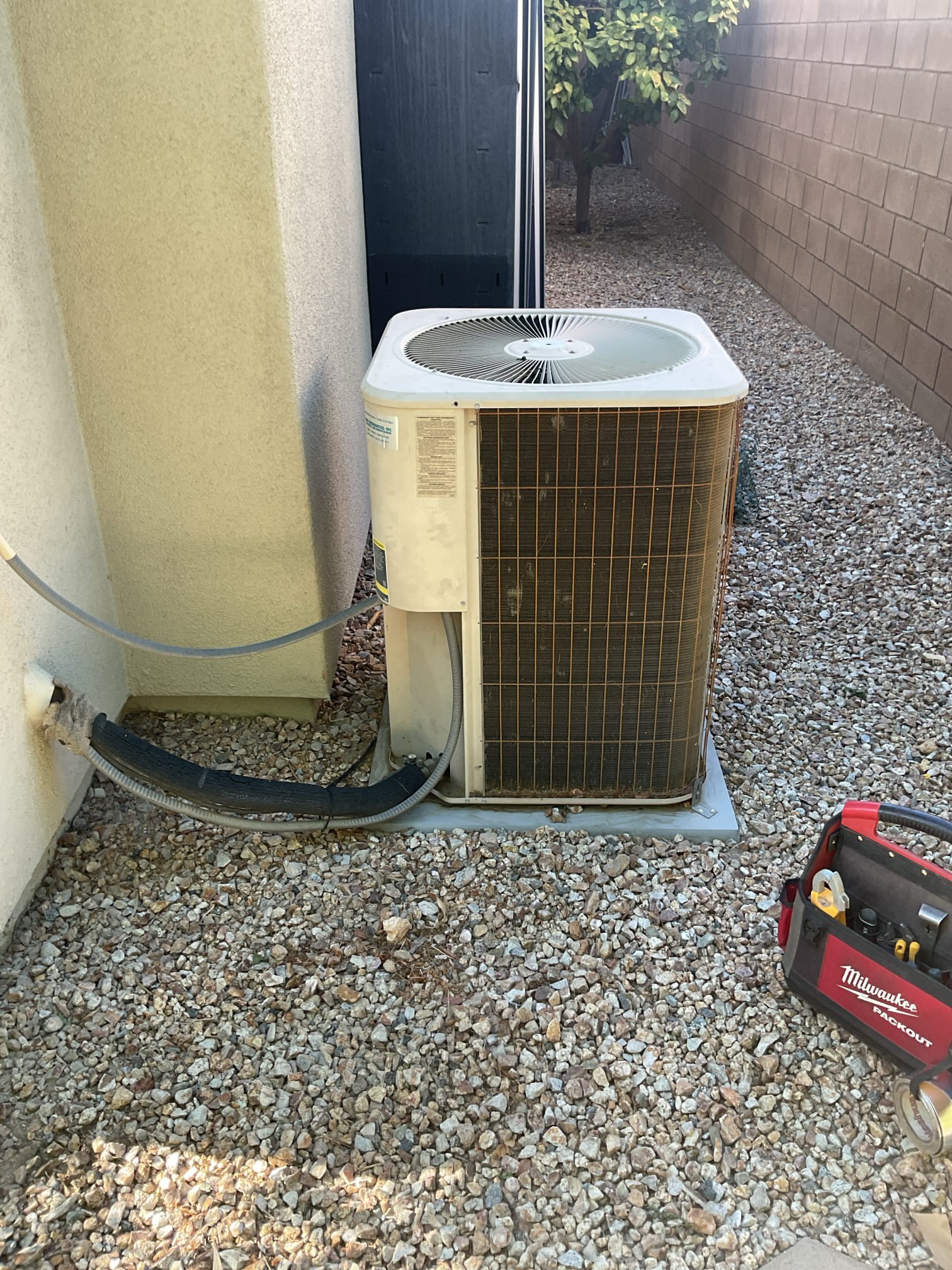 La Quinta, CA - Demand call: no cool

Upon arrival, client stated warm air was coming from supply vents and breaker had tripped for outdoor unit. Diagnostics revealed the hermetic capacitor was zero. Disconnect box was extremely tight and recommended replacement. In the process of replacing disconnect box, the pull mechanism was completely destroyed. Burnt wires and melted plastic was exposed in the box. Ohmed compressor motor windings and tested to ground to see if compressor motor was internally grounded. Pulled the plug from the compressor and tested to see if terminals were grounded. Also tested condenser fan to see if the fan was grounded. Once everything was assembled, I isolated the fan motor and the breaker did not trip. Then I tested the fan motor and compressor motor together and the breaker did not trip.

Synopsis: breaker most likely tripped due to high amperage from failed capacitor and burnt wires at disconnect box. Replacing disconnect box and capacitor was the right diagnostic. Client 