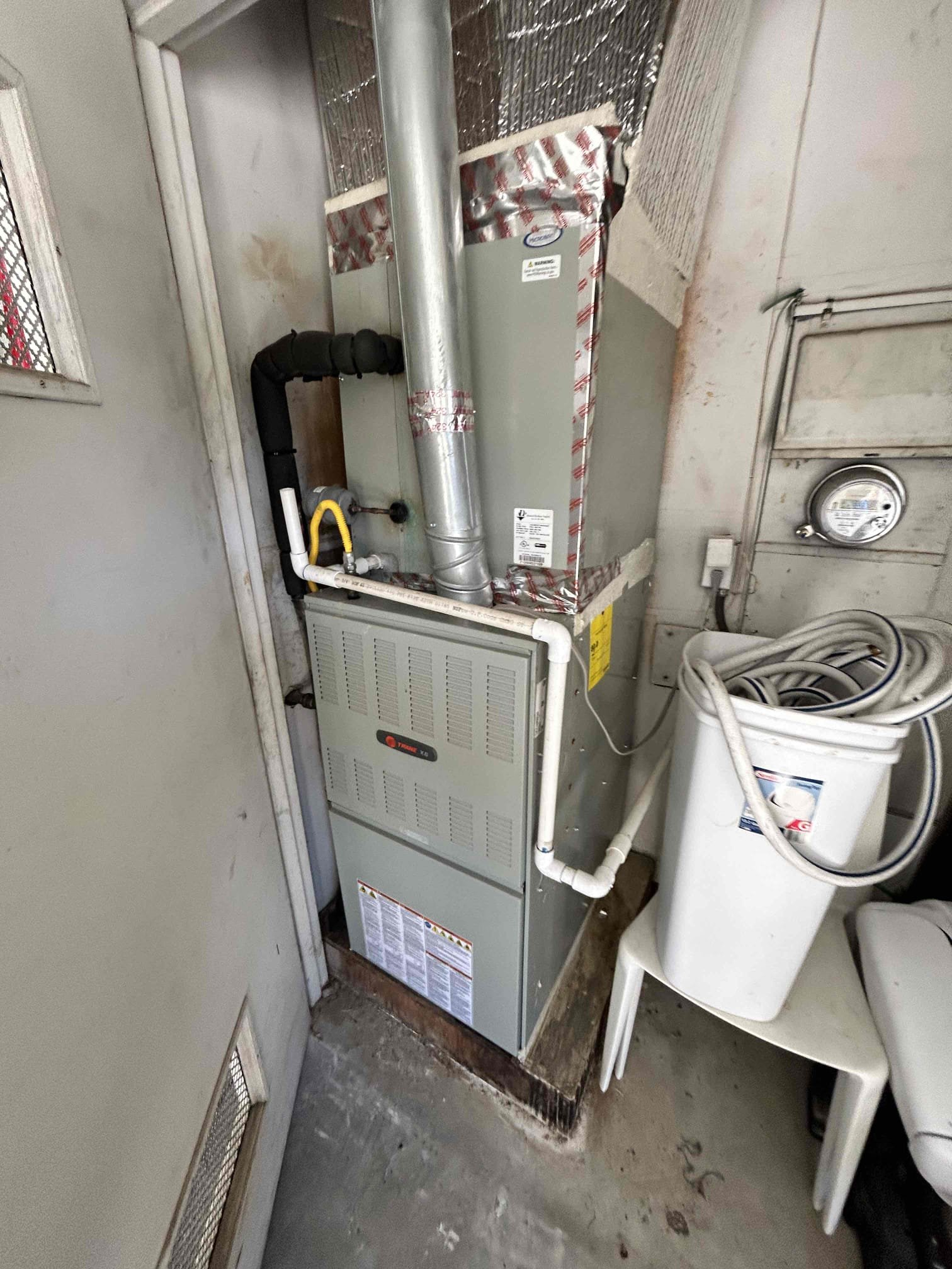 Performed annual maintenance on a 2014 Trane split system. Replaced the 20x25 filter located in the garage and cleared the condensate drain line to ensure proper drainage.
Tested the system operation through the Ecobee thermostat. Upon calling for heating, the system did not respond. Jumped R-W at the furnace, and the heater operated. Called for heating through the Ecobee, and the heating system operated intermittently. Will monitor the thermostat if has intermittent issue.

During maintenance, checked the gas valve, safety switches, blower motor amperage, and flame sensor. Verified furnace operation and checked the heat exchanger.
Inspected the outdoor unit capacitor and found the capacitor out of range, with the HERM side reading near zero microfarads. Informed the client of the failed capacitor, and the client authorized replacement.
Replaced the outdoor unit capacitor. Verified compressor amperage and system operation after replacement. System was operating properly at the time of 