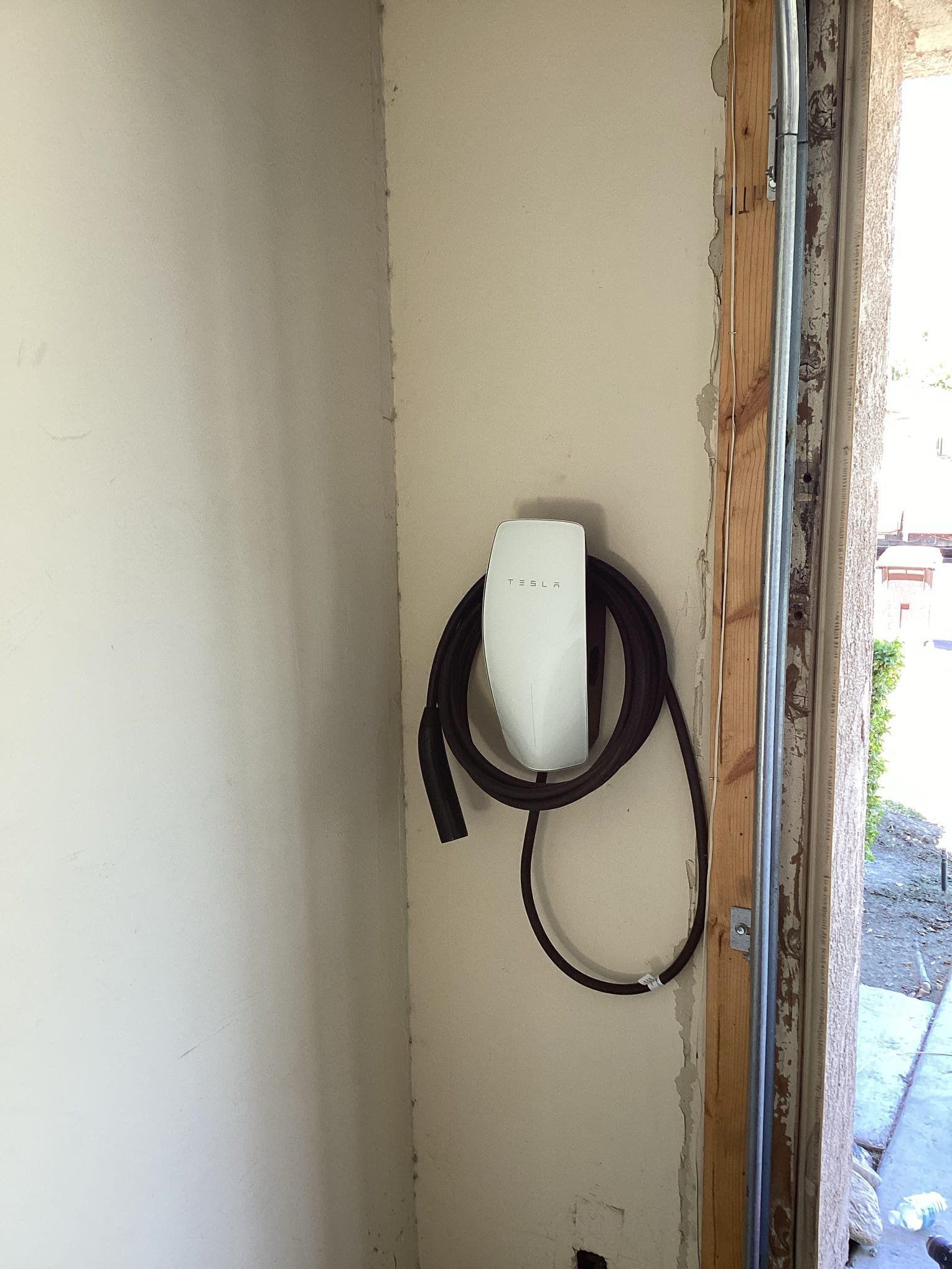 Arrived at customers home to install a new dedicated hard wired circuit for ev charger installed in this visit as well. Penetrated out of the back of the main breaker panel and set car charger on wall directly behind it. Landed all connections and turned breaker on to test unit and power. Verified proper installation with customer based on estimator’s specs. 