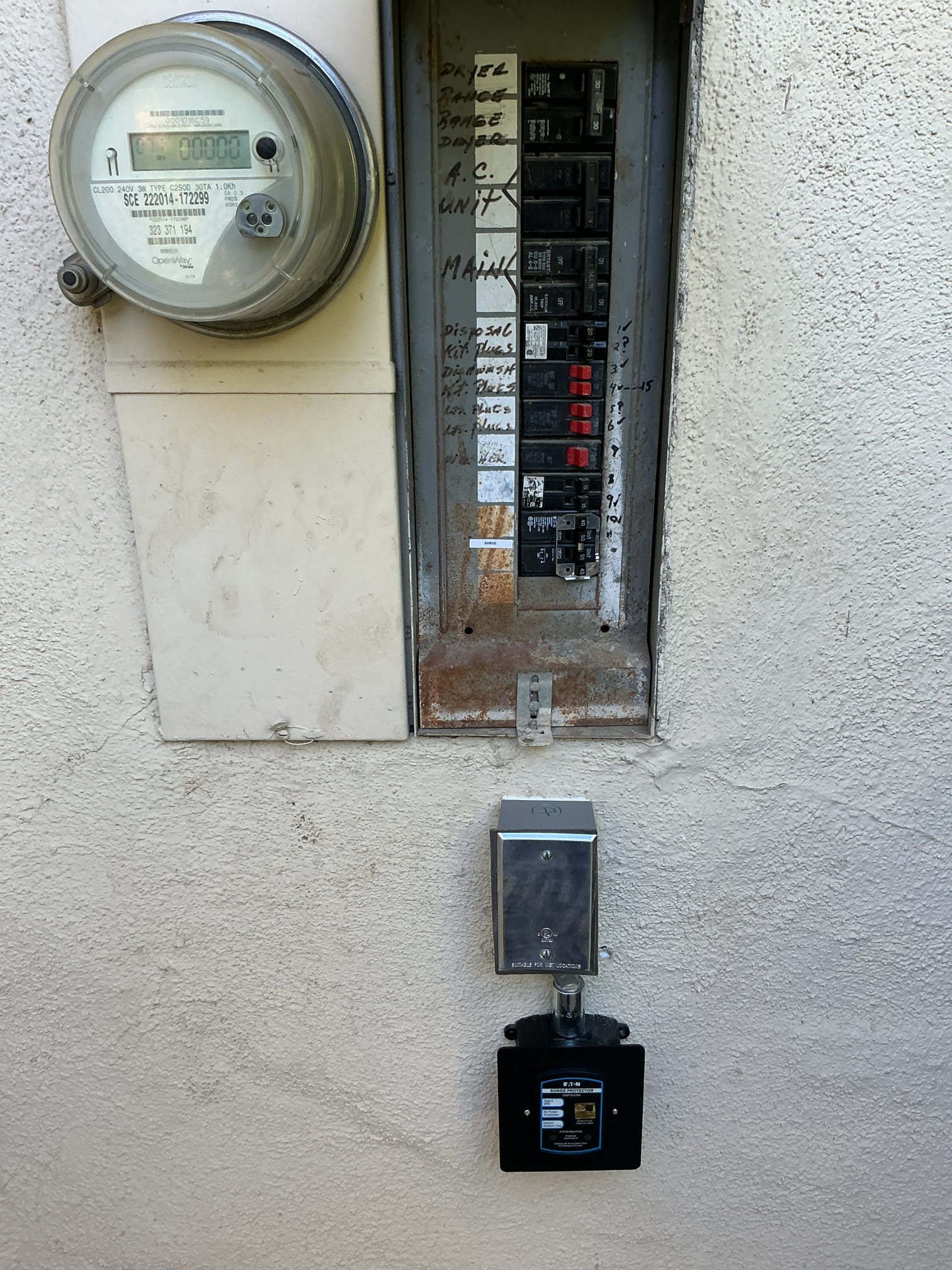 Arrived to install a surge protector cover plate and redo silicone around weather rated box. Removed as much of the previous silicone off the wall box and surge protector. Reinstalled box and surge protector. Applied silicone around weather rated box and installed cover plate on surge protector.