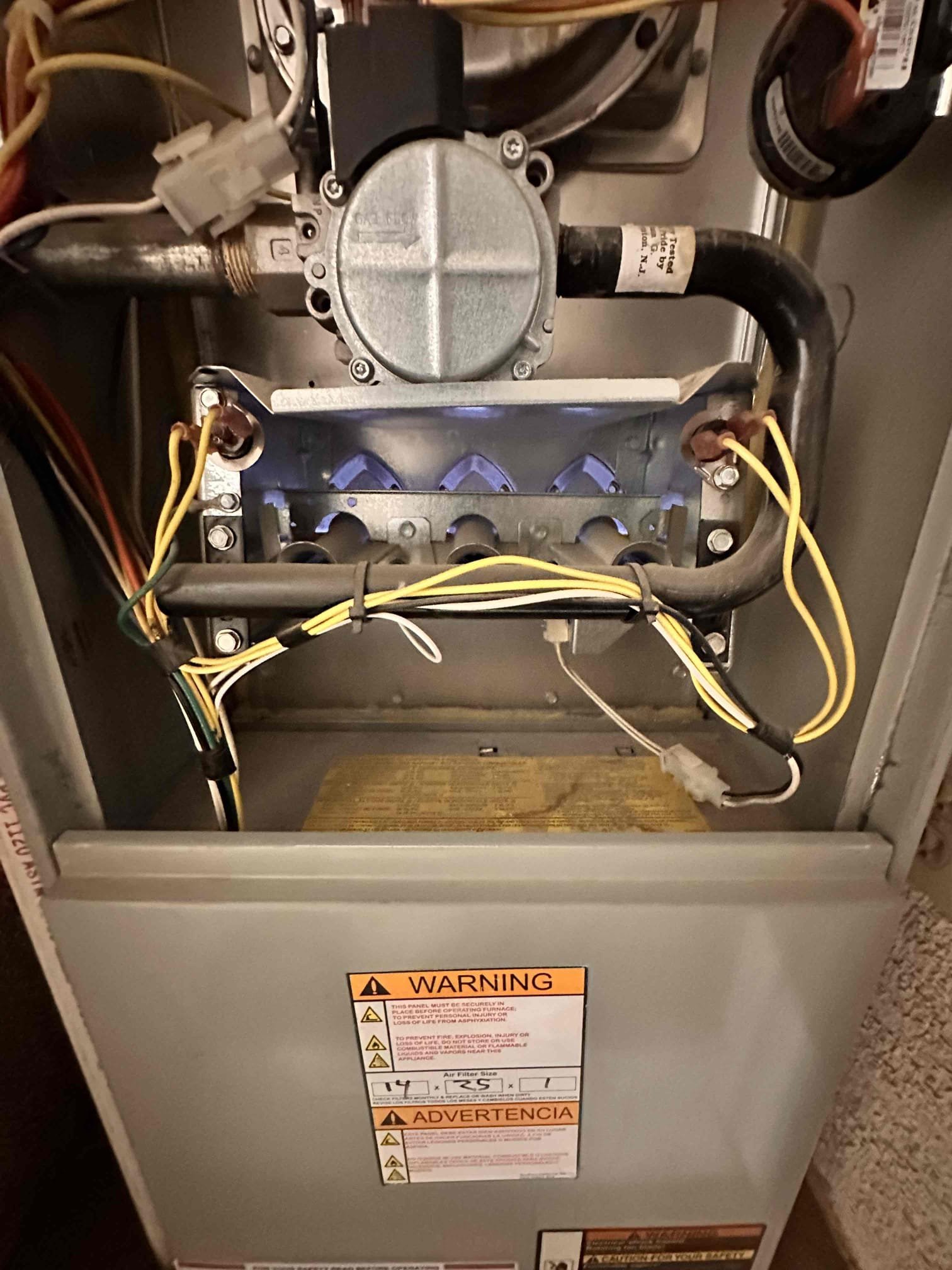 Performed indoor equipment heating maintenance and safety check on the 2008 equipment located in the hallway closet. Manufacture date: April 2008. Model: TUE1A060A9361AB. Serial: 8154KRB1G.

Replaced the 14 × 25 filter located inside the blower compartment. Cleared electrical components and burner compartment of dust and debris. Verified proper sequence of heating operation, checked voltage and amperage, inspected blower motor and capacitor, checked inducer draft motor operation, tested safety/rollout switches, and monitored burners. Verified ductwork was secured and attached to the equipment and in good condition. Checked static pressure, gas pressures, and temperature rise, and cycled equipment to verify proper operation. Zero carbon monoxide detected.

Verified proper operation of the condensate safety switch and cleared the condensate line at the Jones valve. Thermostat checked and operational. Equipment is within manufacturer specifications and heating and operating properly at th