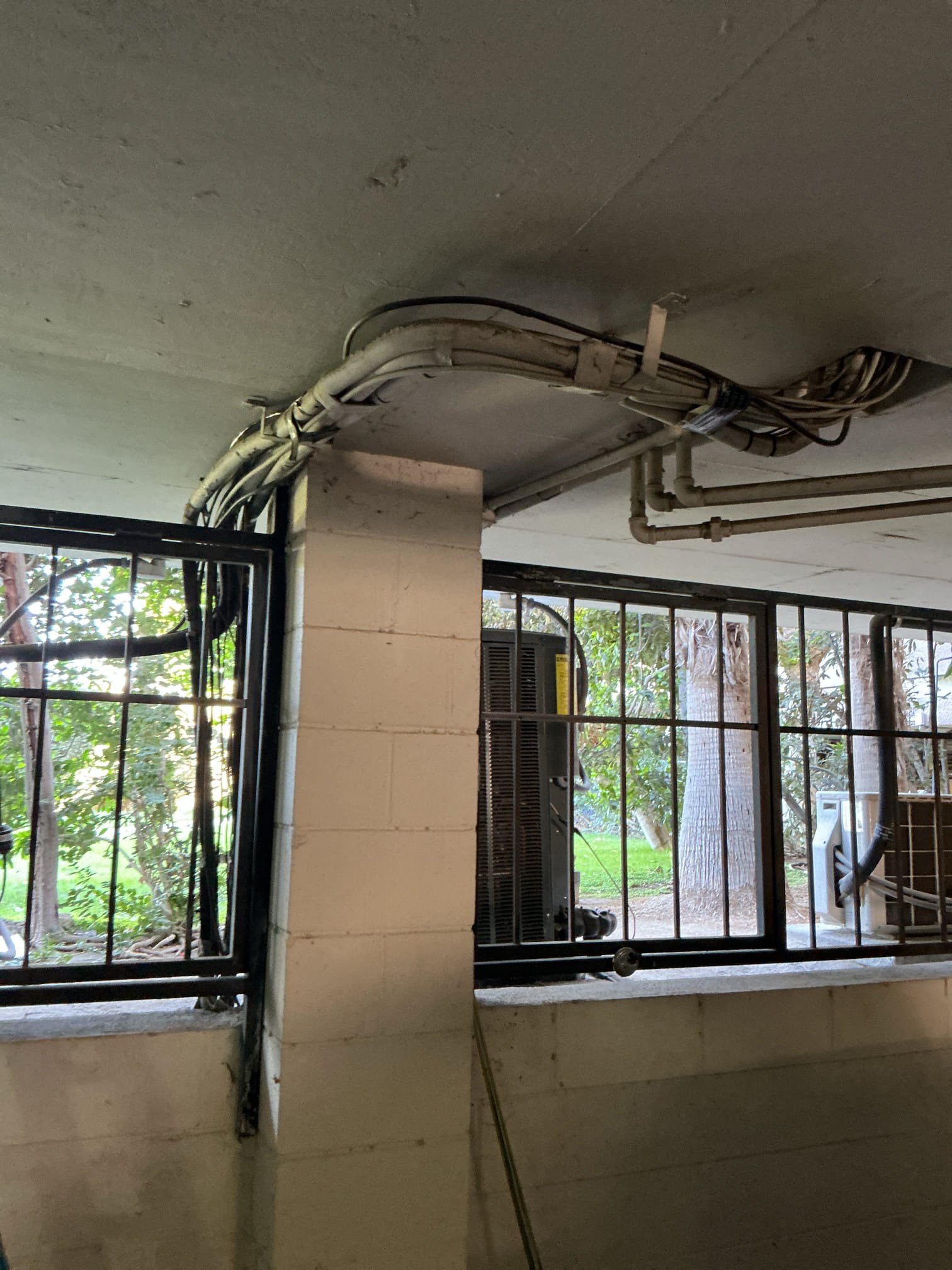 Arrived to run new thermostat wires for new unit being installed. Ran wire in fau closet through existing access down to garage floor and strapped wire onto line set. 