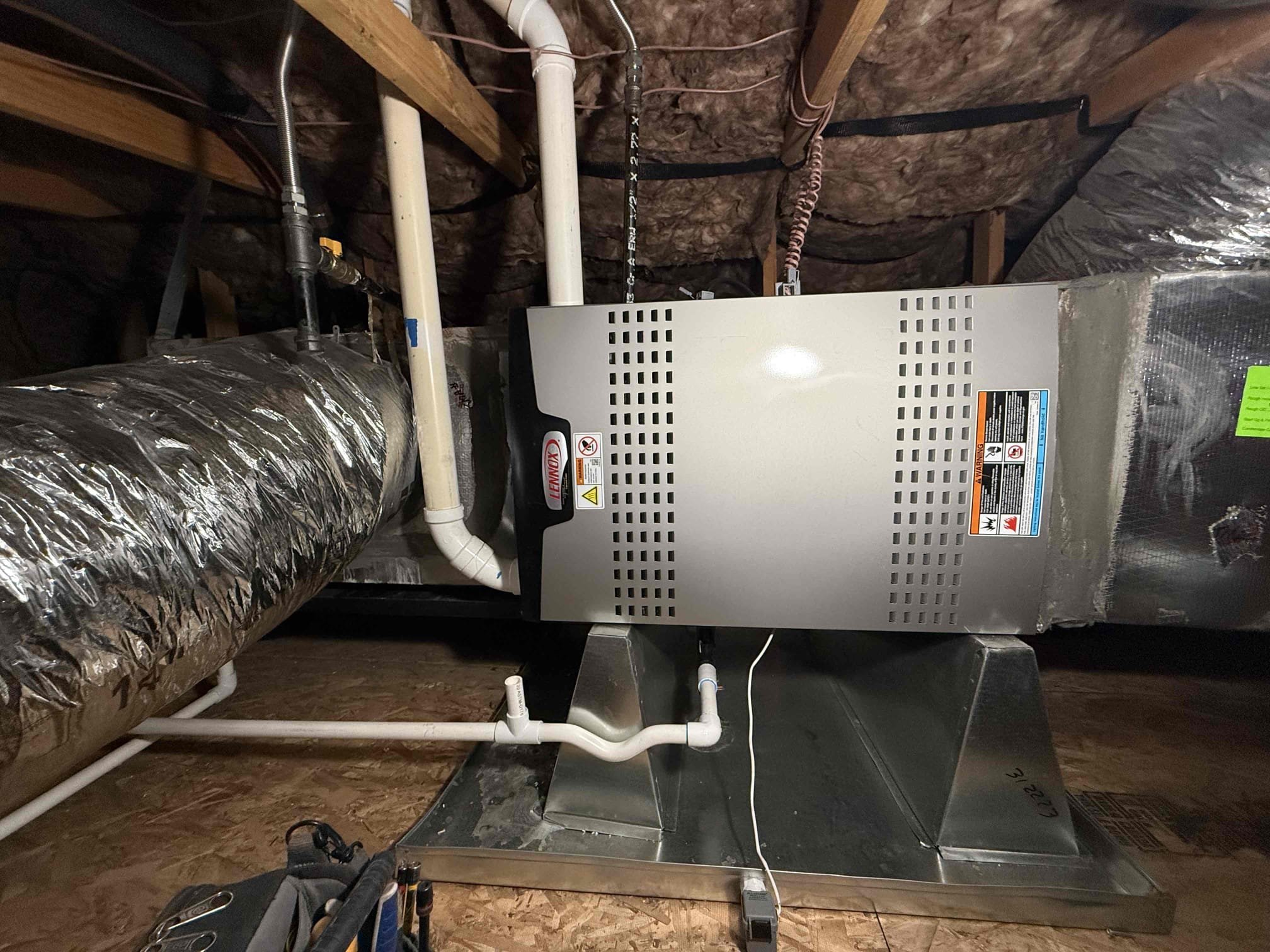 Performed indoor unit be heating maintenance on Lennox 90% condensing gas furnace in master closet attic. Replaced (2) lower wall filters. Honeywell S200 thermostat working properly. Laid plastic over clothing in closet and drop cloth. Cleared off attic platform. Cleared out dust from burner compartment. Cleared condensation drain. Tested furnace after and primed trap. Heating sequence of operations was performed properly. Checked all heating, safety, and electrical components, all working safely and properly. 