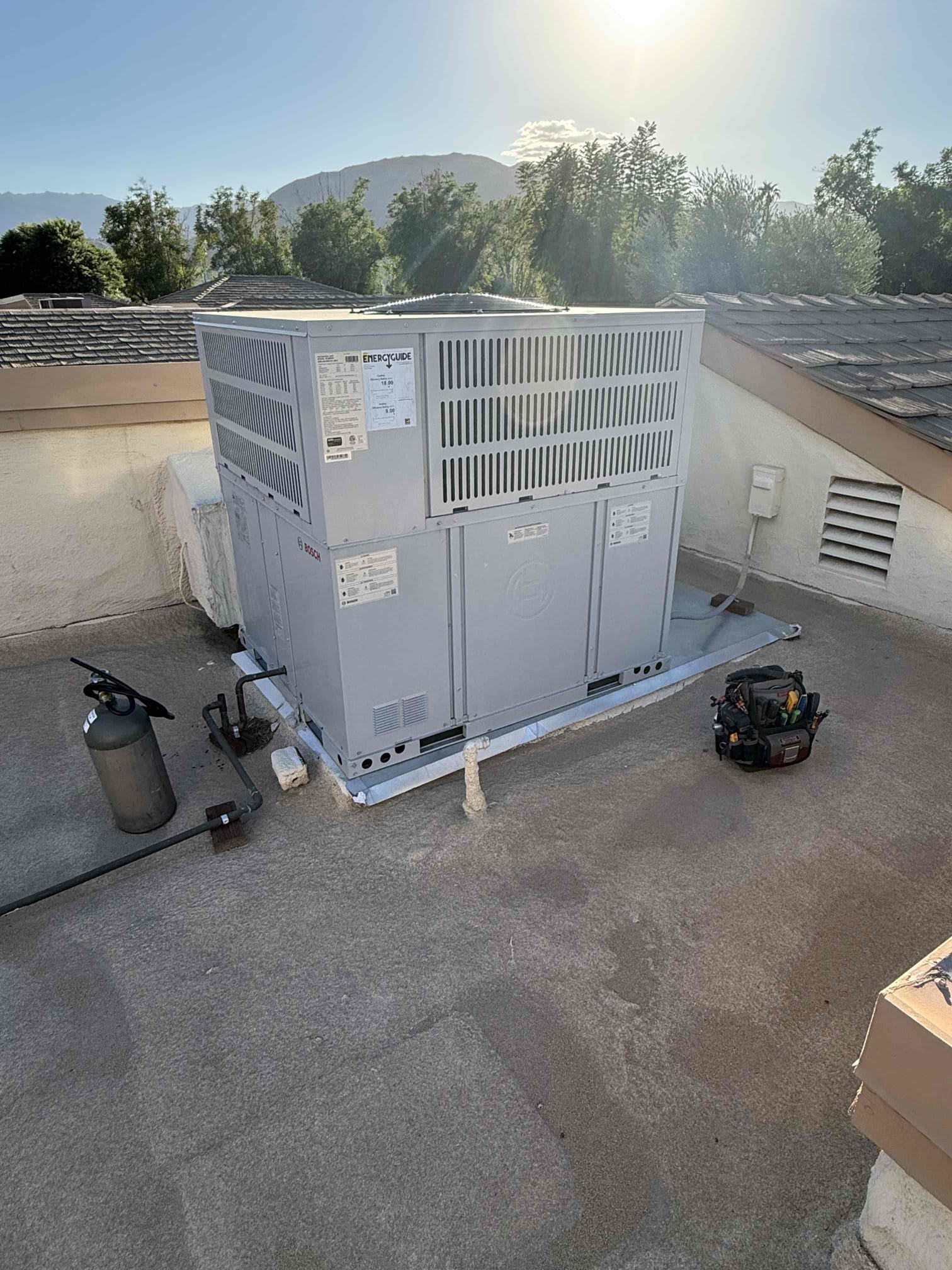Performed heating maintenance on Bosch package unit heat pump on roof (access in backyard neighbor patio, extension ladder). Ecobee thermostat working properly. Homeowner just changed 20x30 lower wall filter , offered spare but he says he’s got plenty. Cleared copper condensation drain on roof , moved over wood mounts 1” to terminate condensation into rain drains/Gutter. Cleaned off any dust/debris from main circuit board panel compartment, and compressor and compressor circuit board compartment. Wiring right and secure, no faults or alerts in history. Due to ambient temperature of 85° Bosch heat pump could not run in heat mode as protection because to do so on a heat pump is not good for the equipment. Ran in cooling and checked compressor amps and fan motor amps. 22° temperature split. All components are working properly to manufacture specifications. Informed homeowner of heat pump protection alerts for high ambient temperatures (ATL - Ambient Temperature Limit). Scheduled with home