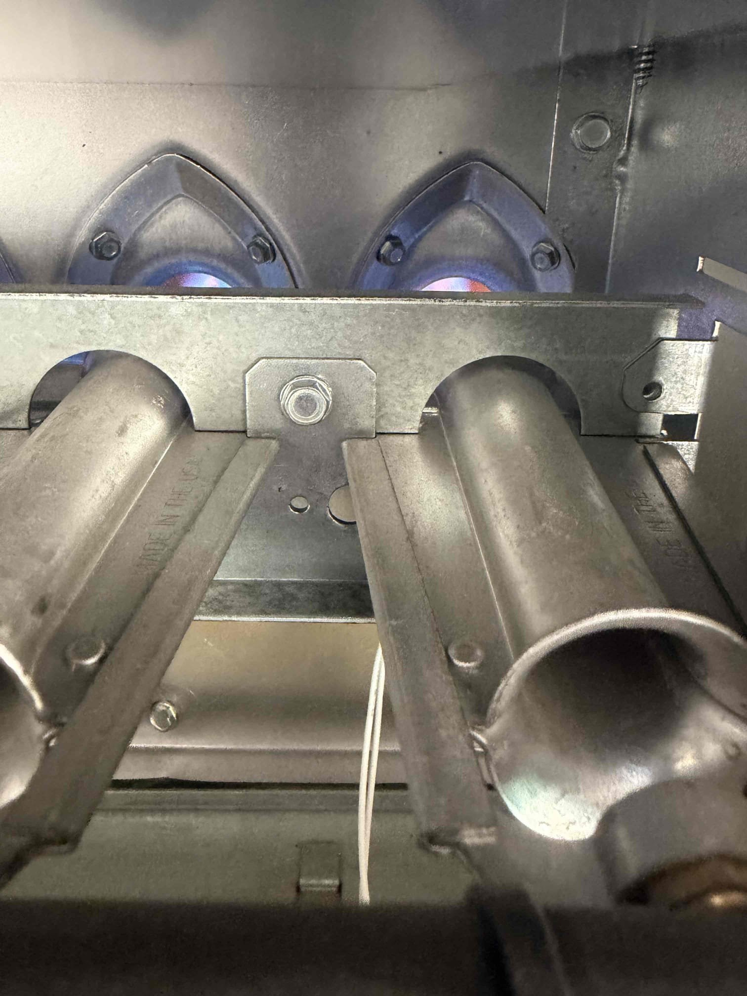 Performed indoor safety maintenance on two American Standard furnaces. Both FAUs are located in the garage, with filters installed inside the filter racks. Replaced one 20x25 filter and washed the reusable filter. Flushed the condensation line to ensure proper drainage. Checked the sequence of operation on both systems and verified proper heating operation. Inspected amperage and voltage readings, blower speed, electrical connections, and capacitors. Checked for carbon monoxide and verified the temperature rise was within the manufacturer's specifications. Cleared accumulated dust and debris from the electrical component compartments. During maintenance, recommended replacing the thermostat due to its condition, and the homeowner approved the replacement. Both furnaces are operating within specifications in heating mode at the time of maintenance. Provided the homeowner with a Starbucks gift card.