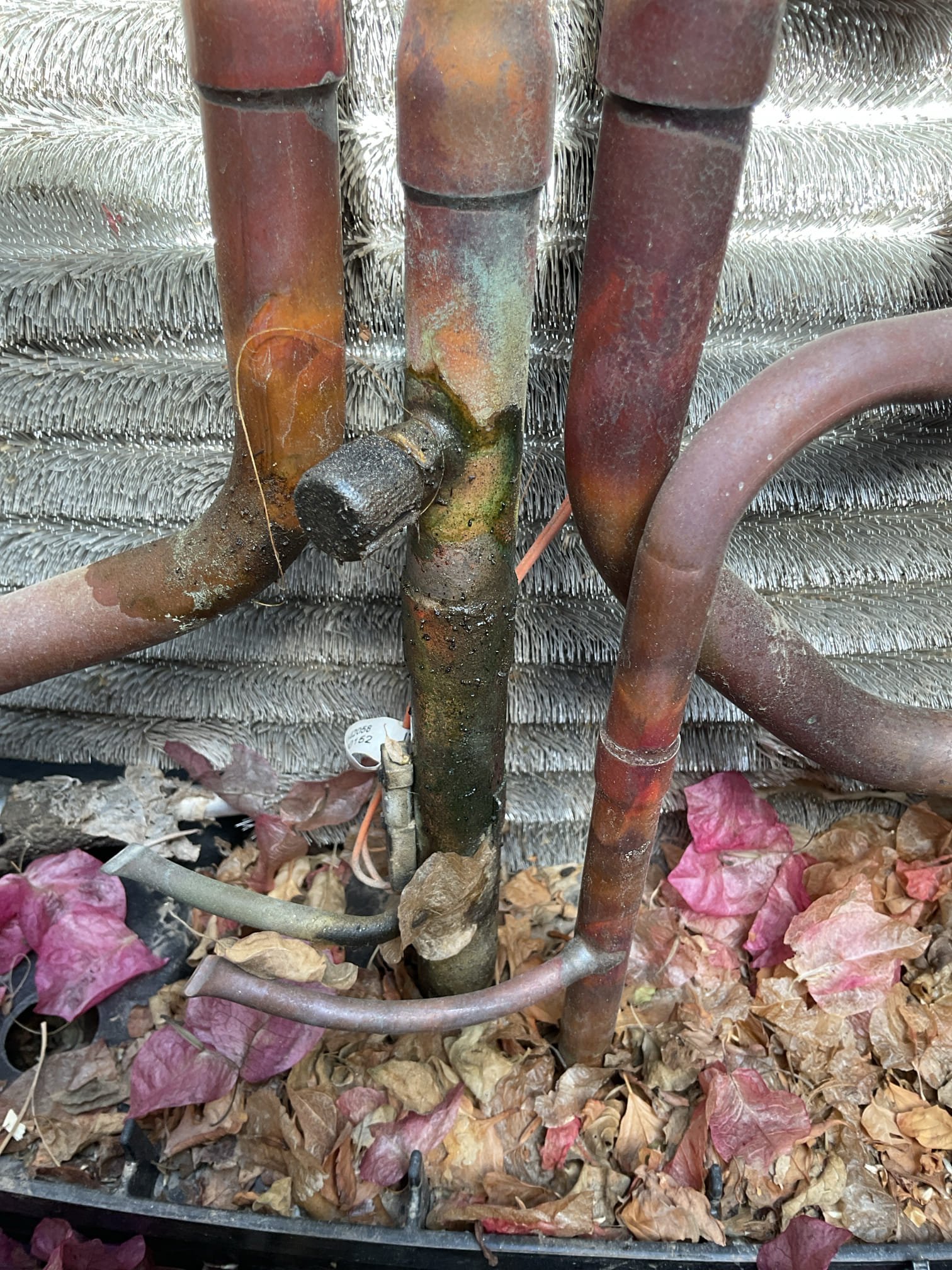 Outdoor safety check and maintenance: follow up from previous maintenance. 

True suction port Schrader valve was defective. Replaced Schrader valve at true suction port and sealed with cap. Checked voltage at disconnect. 120 V was found on each leg and 240 V were coming in and out of box. Checked temperature sensor J 22 discharge sensor. Found a resistance value of 1.2 5K ohms temperature value 175°. Charged system with 4 ounces of refrigerant, documenting before and after subcool temperatures. Cleaned oil and refrigerant from true suction line. Replaced 20 x 30 and 14 x 14 air filter. System is currently cooling the home at the time of maintenance – Starbucks. 