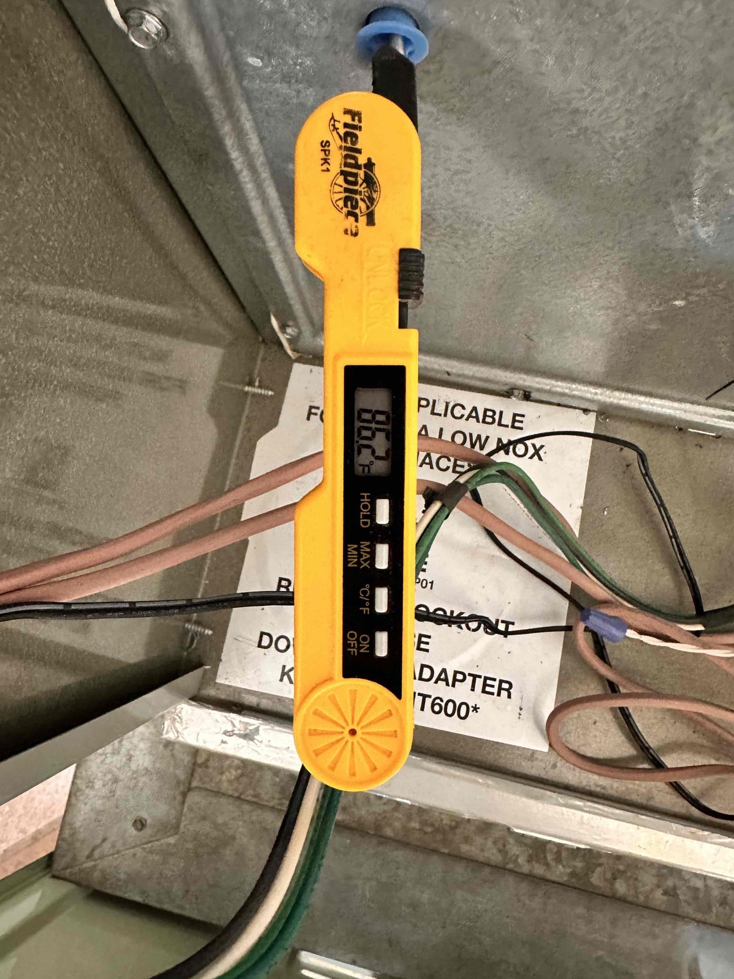 Performed scheduled indoor and outdoor safety and maintenance check on one 2020 Trane XR split heat pump system. Indoor equipment is located in the garage, model P0V0D000M60SBAA, serial 20424H65JG. Outdoor equipment is located on the east end of the home, model 4TWR7060A1000DB, serial 2049441B2F. Filter is 24 × 24 and located within the filter rack.

Cleared electrical components and disconnect box of dust and debris. Tightened and secured electrical connections at the disconnect. Verified proper safety switch operation. Cleared condensate line; outside termination is next to the outdoor equipment on the east end of the home.

Verified temperature split and heating temperature rise. Return temperature measured 86.2°F and supply temperature measured 123.1°F, providing a 36.9°F temperature rise. Checked compressor voltage, running amperage, inrush current, and outdoor fan amperage. Checked start capacitor and both FAN and HERM sections of the dual run capacitor; readings were within requ