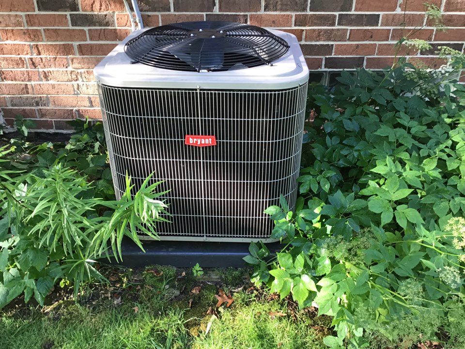 Maintenance on a residential Bryant air conditioner in Washington township.