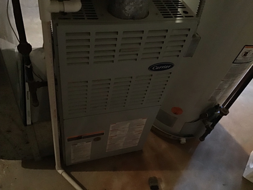 Maintenance on a residential Bryant furnace in Romeo.