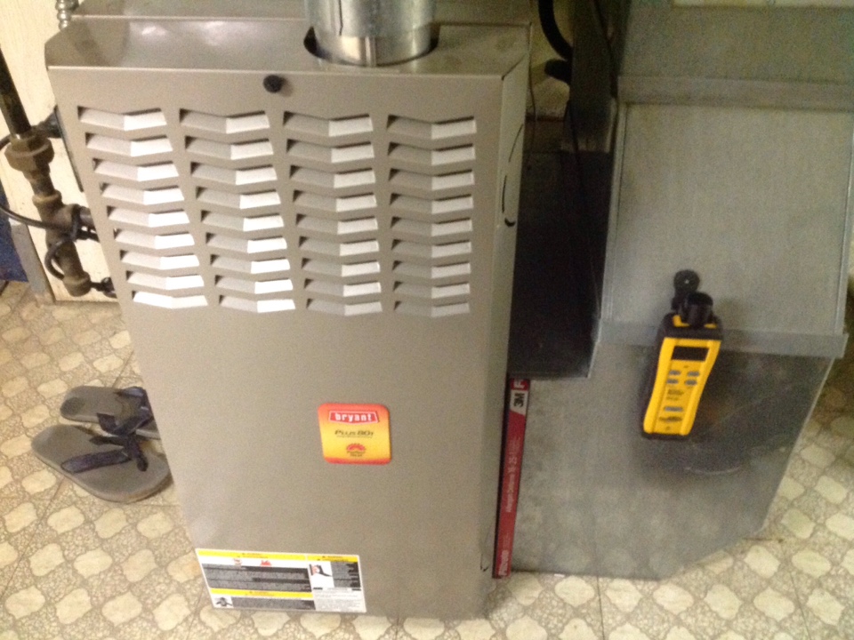 Maintenance on a residential Bryant furnace in Utica.