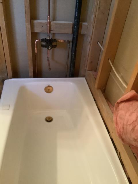 Removed old bathtub and shower valve. Installed new customer supplied shower valve, customer supplied bathtub, and waste and overflow.