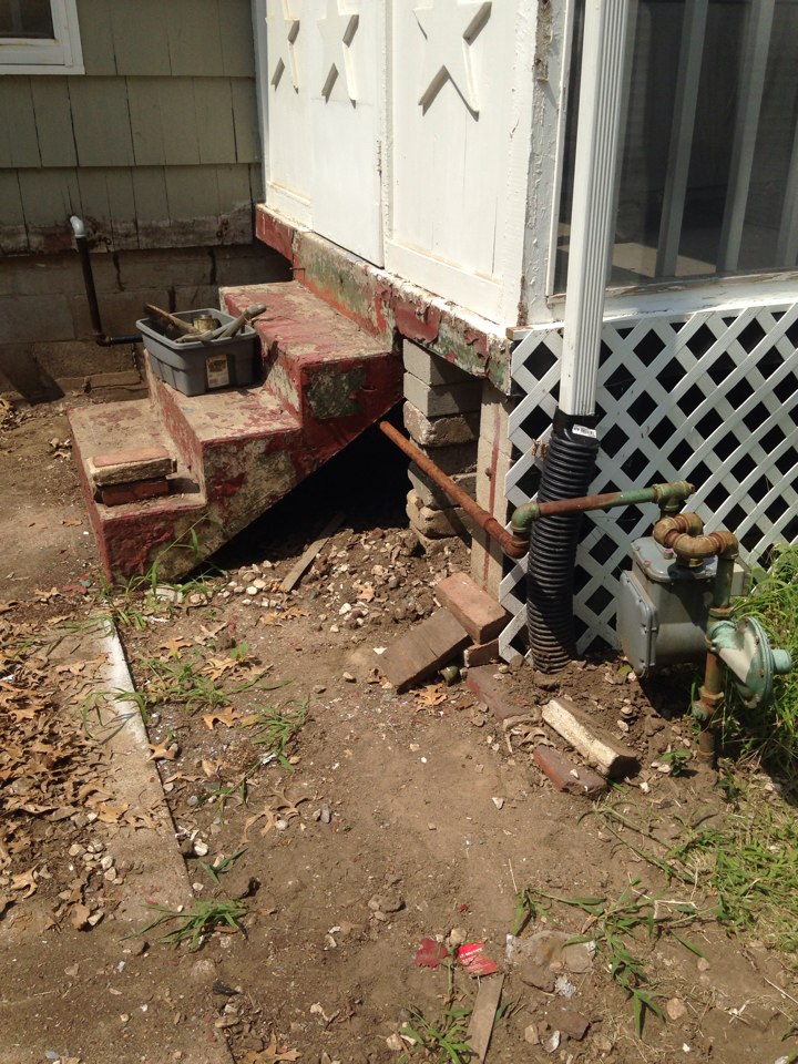 Reroute gas line to go Under steps from meter.