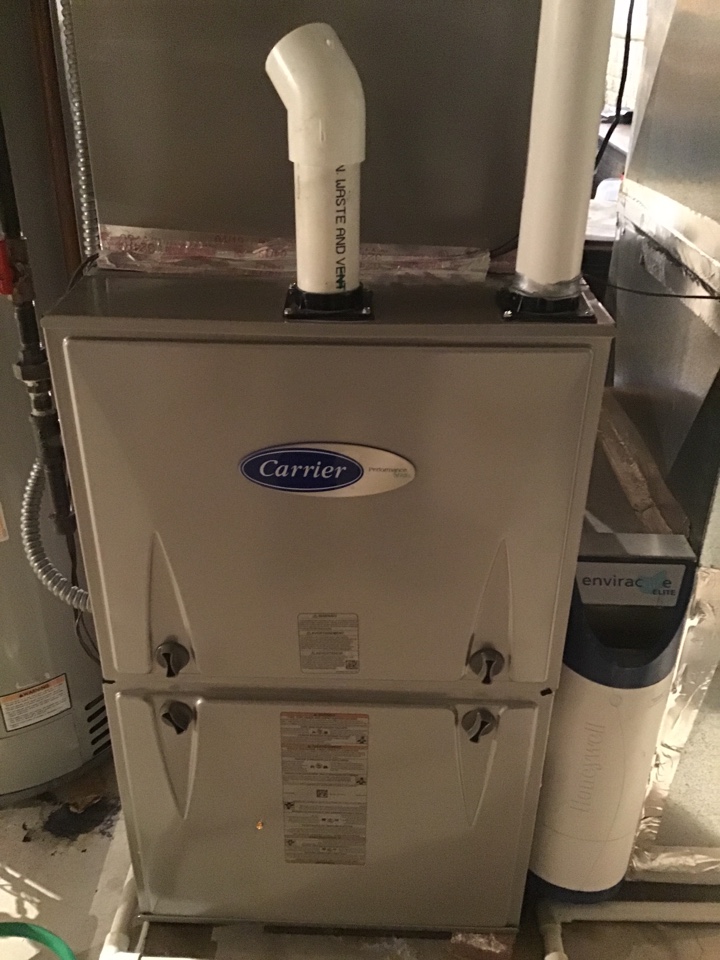 Performing a preventative maintenance tune up on a carrier furnace for Mrs.Barnes