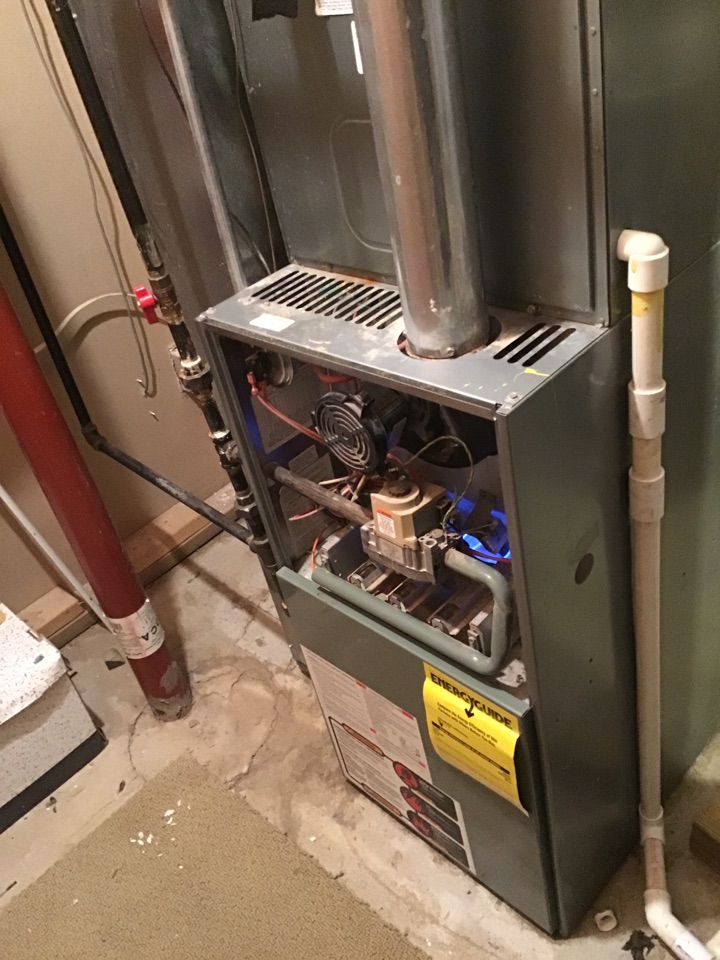 Repairing a furnace.