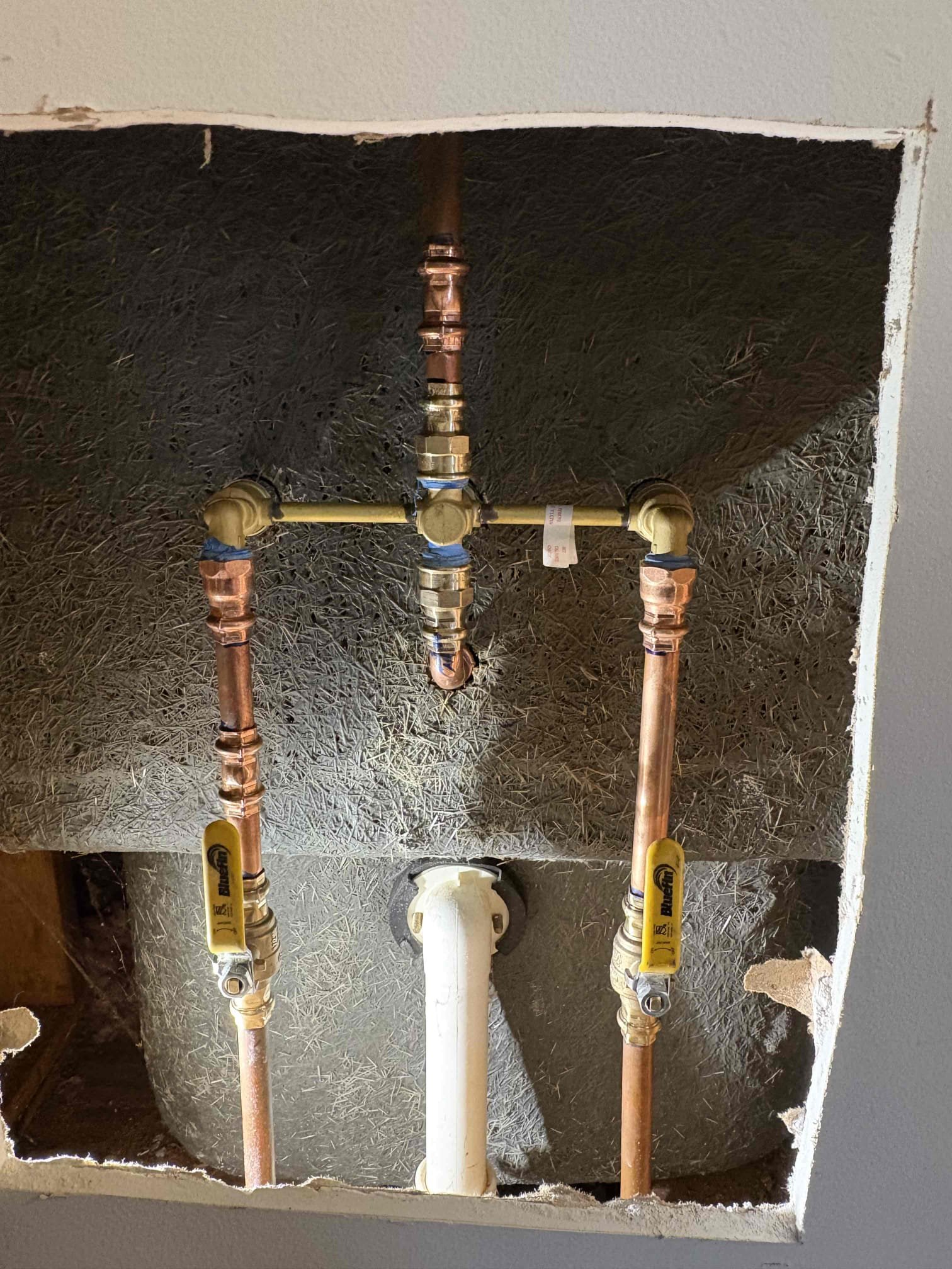 Client called us out due to there being a leak coming from the upstairs hall bathroom shower valve, causing some damage below. Sheetrock had already been cut open for us to see the valves issue. When running, the shower valve was leaking from the cold side stem in the wall, due to it being broken out the valve. Unknown for sure the cause of the issue, but client did have over 95 psi of water pressure in the home which is a good bit higher than the safe range of 50-79 psi. 

To correct the water pressure issue we located the old pressure reducing valve and replaced it with a new 3/4” watts 25aub pressure reducing valve and also added a ball valve shutoff for the whole home so client can confidently use in future if needed. Home water pressure is set just over 50 psi. 

We cut out the old shower valve and added new ball valve shutoffs to the water lines so we could turn water back on to home. Installed new glacier bay 3 handle tub/shower valve and chrome trim with shower head. Caulked ar