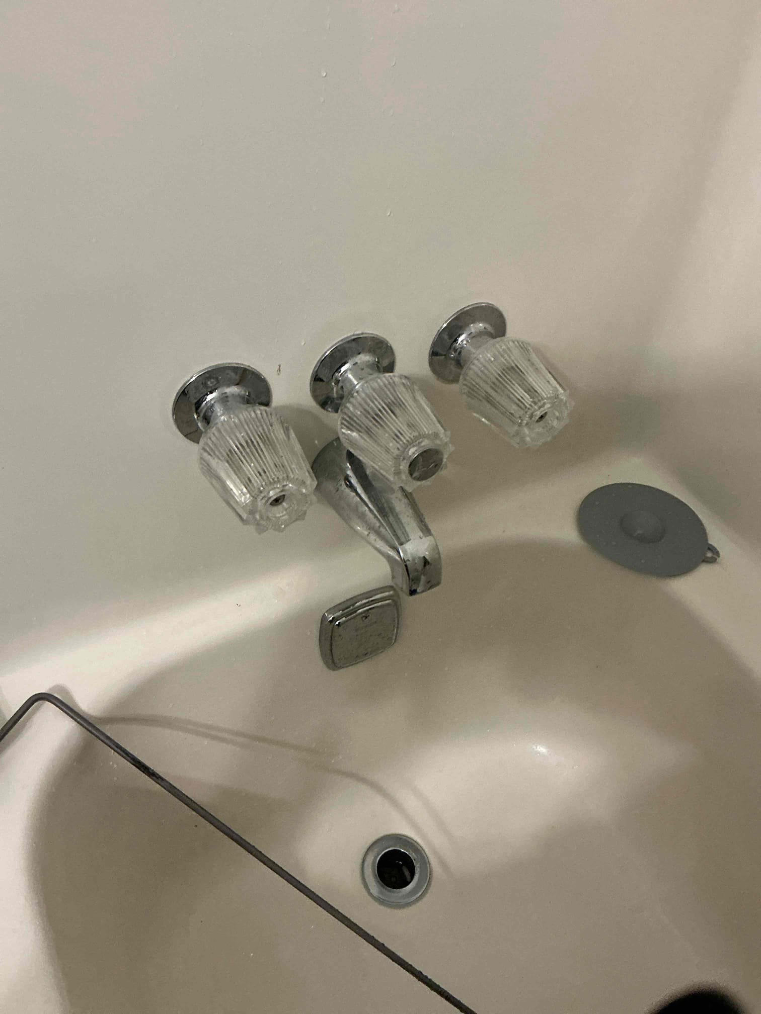 Client called us out due to there being a leak coming from the upstairs hall bathroom shower valve, causing some damage below. Sheetrock had already been cut open for us to see the valves issue. When running, the shower valve was leaking from the cold side stem in the wall, due to it being broken out the valve. Unknown for sure the cause of the issue, but client did have over 95 psi of water pressure in the home which is a good bit higher than the safe range of 50-79 psi. 

To correct the water pressure issue we located the old pressure reducing valve and replaced it with a new 3/4” watts 25aub pressure reducing valve and also added a ball valve shutoff for the whole home so client can confidently use in future if needed. Home water pressure is set just over 50 psi. 

We cut out the old shower valve and added new ball valve shutoffs to the water lines so we could turn water back on to home. Installed new glacier bay 3 handle tub/shower valve and chrome trim with shower head. Caulked ar