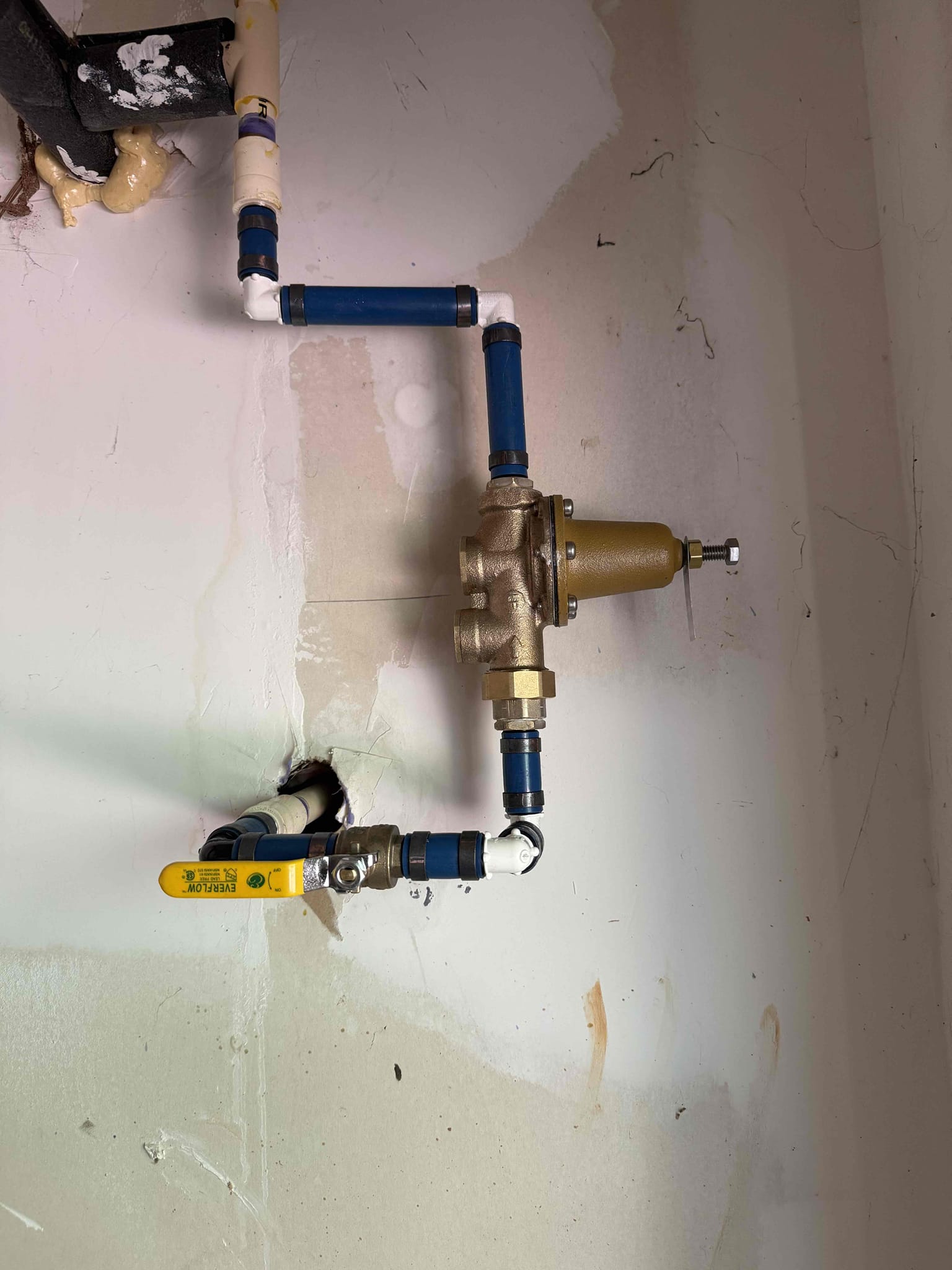Homeowner states that she noticed the shower after would sometimes get hot and other times tepid. She called us to see if the issue was fixable without changing the EWH. Upon arrival homeowner greeted me and showed me the EWH located in backyard and it is 14+ years old. I explained and recommended replacing due to its age and high water pressure which she agreed to and I stated by draining the EWH. Once It was drained I cut off the pipe and installed CPVC to copper adapters and also removed the PRV with the main shut off and installed CPVC to PEX adapters. I then put the new EWH together with the extended warranty and stickers and brought to the new install place and placed the drip pan first. Once in place I then installed the new shut off and PRV with pex pipe and crimped it together using copper rings. Then I pressed the new pipe connecting the EWH and then I waited for the glue to cure. Once enough time passed for the glue to cure I turned on the meter and turned on the main shut o