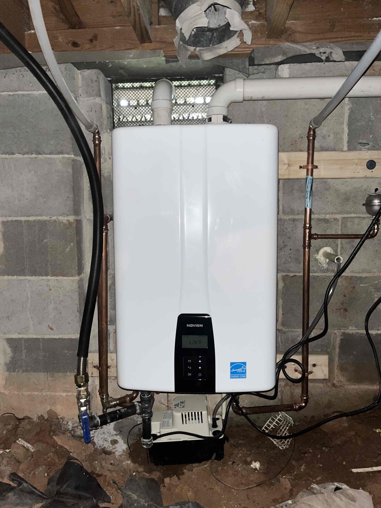 Price is to furnish and install Navien tankless unit to existing gas, water, and new venting in according with national and state code requirements. Price includes provision, mounting, connections, and any lines that need to be run to the unit, as well as penetrations for venting to the exterior of the home. 

Returned and installed new Navien tankless water heater with a new service valve kit, thermal expansion device, and condensate pump. Made new penetrations to the exterior of the home for the vent, condensate, and t&p. Ran new gas and water lines to the unit. Tested all work to ensure proper function and no leaks. None were found. Upon testing the t&p found that water is leaking into the crawlspace in the ground where the condensate pump is sitting. Made customer aware that getting a foundation company to inspect the crawlspace seal is crucial to protecting the new equipment. 