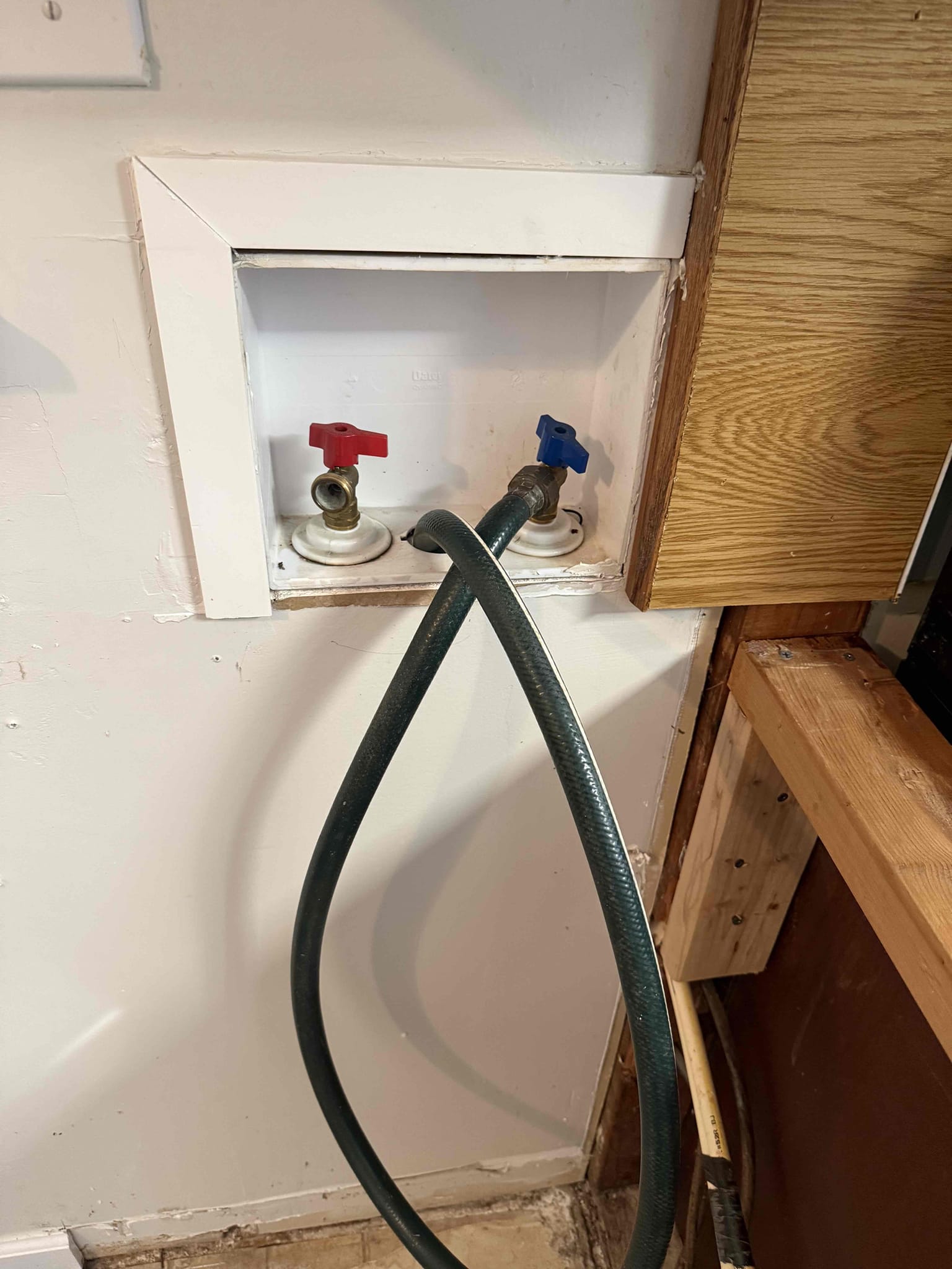 Homeowner states that a day ago he was running water from the washer box down the drain and went to the basement and saw the wood had water marks that were very fresh and believed it was from the washer box drain and called us to see if that was the case. When I arrived homeowner showed me what he did and we went to the area in basement and the water marks were a lot closer to the kitchen sink drain then the washer box drain and I informed the homeowner. He ran the kitchen sink and the washer box hot side and I could not see any leaks or anything that could be causing the leak. I informed the homeowner to use a water restoration company to so they can attempt to find the leak since they have moisture meters and infrared cameras. Homeowner understands and will contact a company and unfortunately there is no signs of a drain or water leak so I cannot do anything at this moment. 