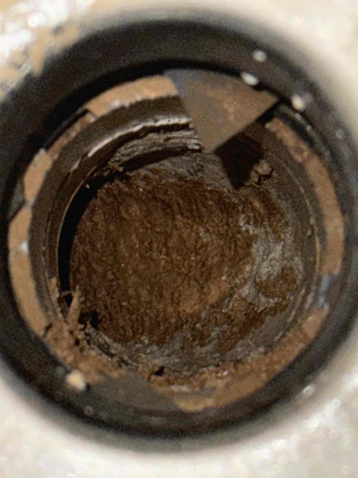 Homeowner states that their shower in the guest bathroom was remodeled a few years ago and had a relative use and it wouldn’t drain and called us to fix the issue. Upon arrival homeowner greeted me and showed me the bathroom shower and it was dry but as soon as you ran water it wouldn’t drain. Homeowner states that they attempted to clear the line but rocks and grout piece would only come up with the water. I offered different solutions and she opted to start with the simple drain cleaning without snake and I use an auger with no luck then I moved to the snake and same thing happened no luck it wouldn’t drain just feel like I was hitting something and I passed it but wouldn’t drain. Finally I replaced the p trap but still wouldn’t drain and the issue is the studor vent is below the shower pan and needs to be brought up to allow it to breath and have more room for the water to drain properly. Homeowner understands and will talk to husband after we provide a way to run the new vent upwar