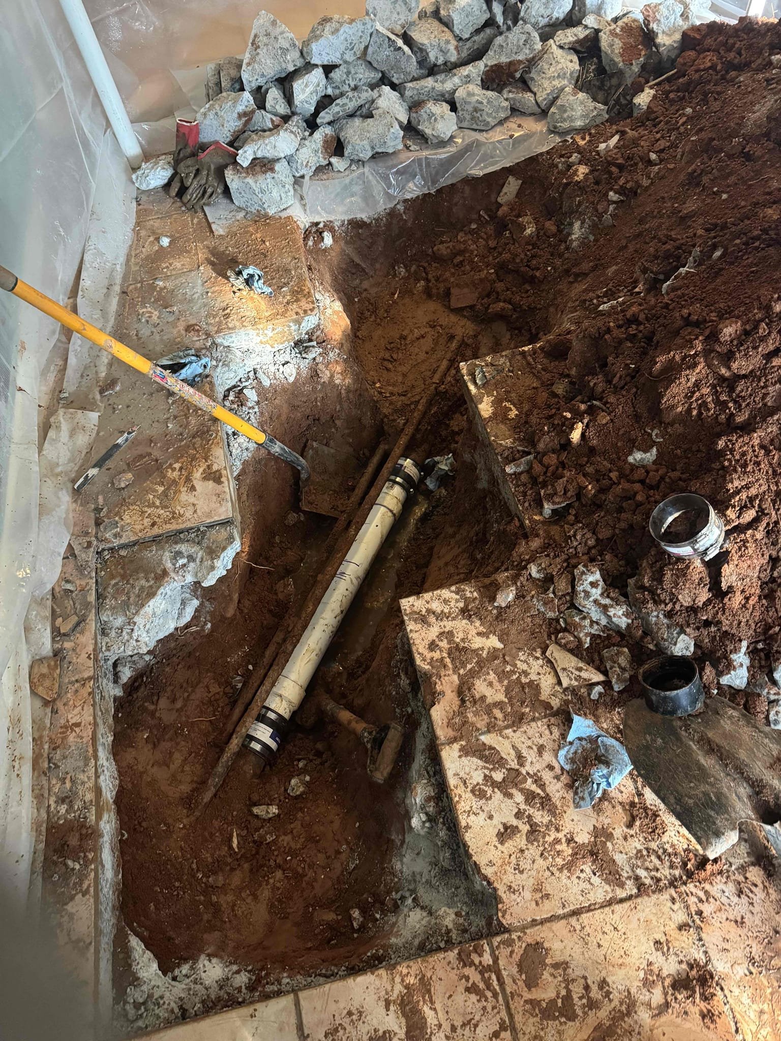 Customer have a sewer backed up at the washer drain line. I try to hydrojet it but it wasn’t working. I suspect that the pipe might be broken. we located where the broken it’s in the middle of the of the living room basement. We recommended the customer to excavate and cut out the slab to access the pipe and replaced the section of pipe. We found that about 3‘ of 3“ cast-iron drain line have a broken in the bottom of it. We replaced that section up to 3 feet, wate tested and put back to dirts. Customer is fully aware that we do not put back the concrete or the tile flooring. This job come with a one year warranty.