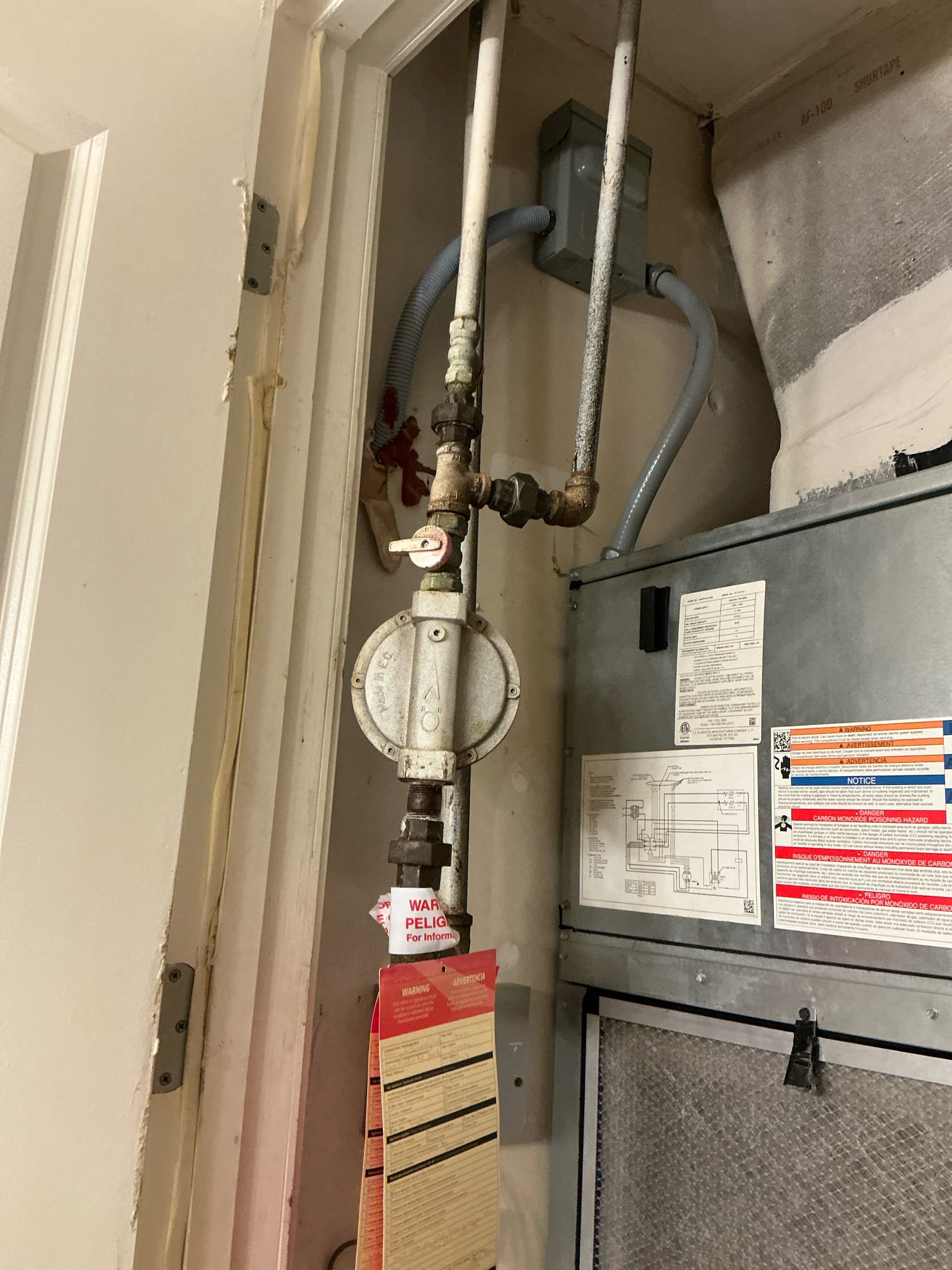 Customer had AGL out that shut off gas to apartment.  Text said that both gas fixtures in apartment were leaking. Disassembled trim plating on built-in oven. Removed carefully and accessed gas line to stove top. There is no isolation valve for the fixture. Cut drywall around fireplace key to find no isolation valve either. Installed two isolation valves for gas fixtures in home. Once valves were installed disconnected gas regulator and proceeded with gas pressure test. After 20 minutes of being pumped up to 15 psi there was no drop in pressure. Advised landlord that fireplace fixture and stove top need to be replaced or repaired for being source of gas leak.