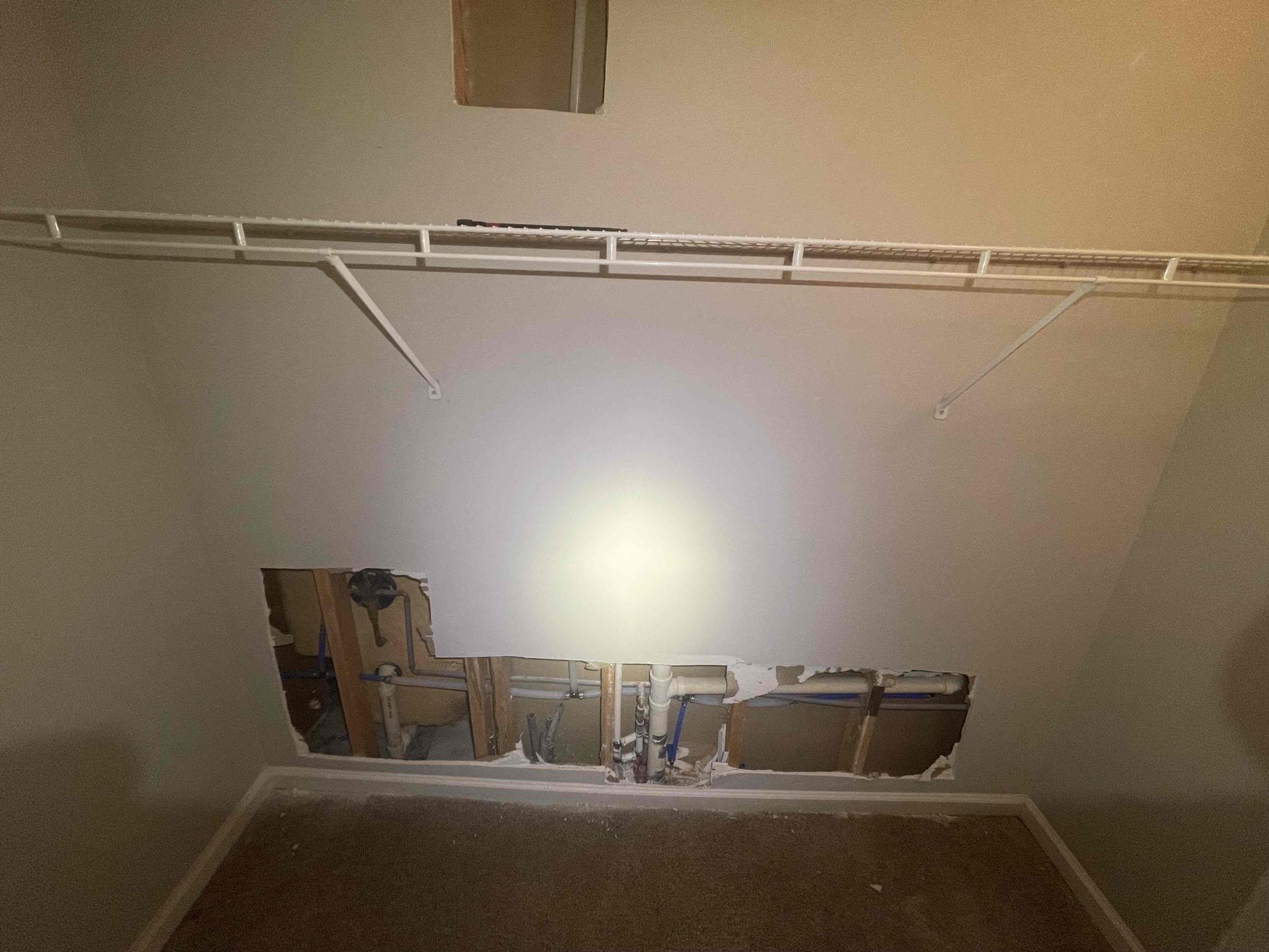 11 drop lines total. Cut out drywall in multiple parts of the house. Disconnected all cold polybutelene lines under the slab. Drilled up into attic and ran new pex lines across attic, dropped down into walls. Insulated all pex piping I installed in the attic. Stubbed pex back out into cabinets with new stop valves or tied back into existing fixtures. Replaced hose bibs on both sides of the house. Pressurized house to ensure a leak free install. Meter no longer constantly spinning. Hot piping was already partially repiped by another company. Still some polybutelene at the fixtures and under the slab on the hot side. Sent property manager a text message notifying him of what I saw once the walls were open. No further issue at this time. 