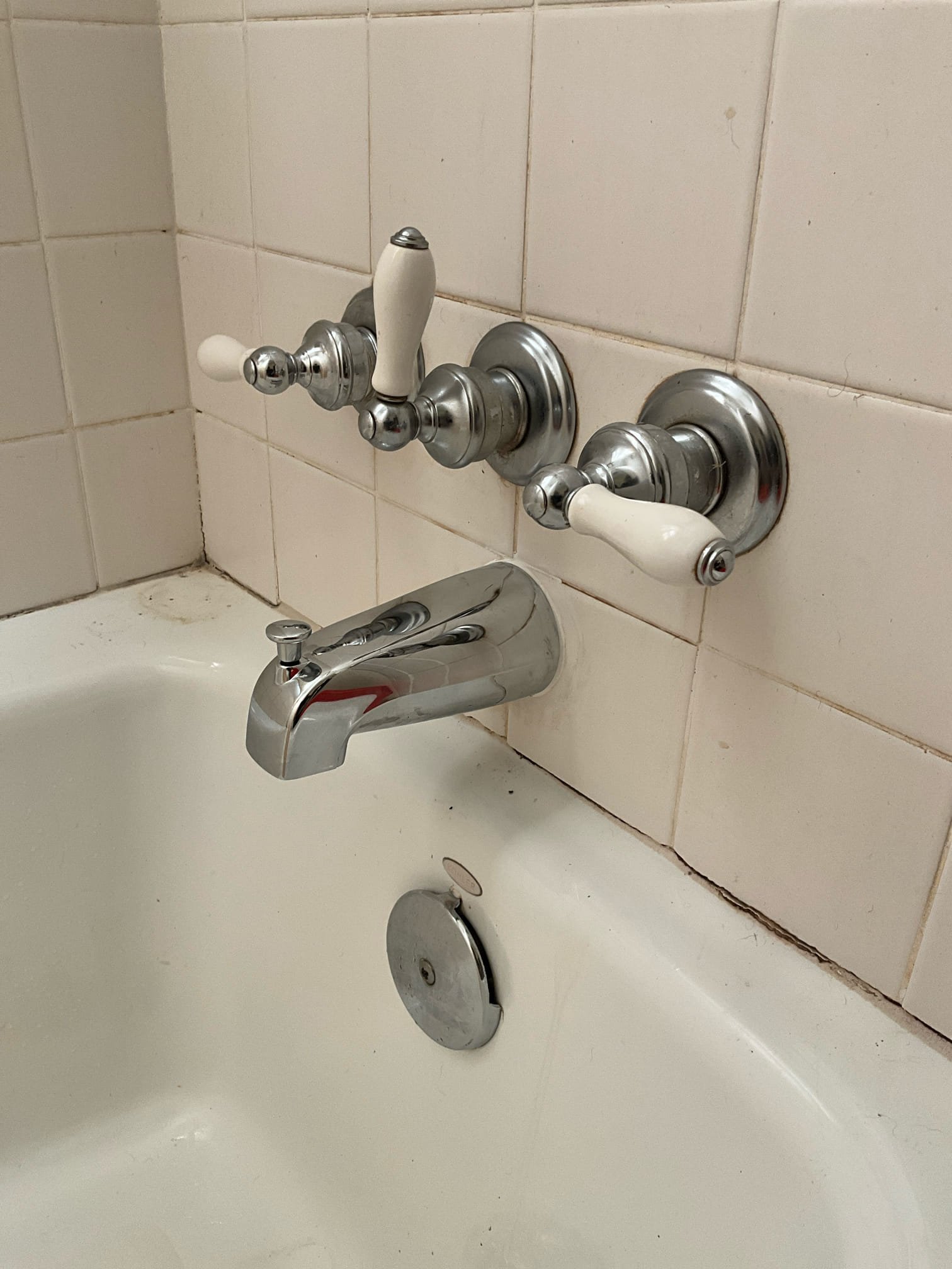 returned and replaced tub spout that was sticking too far out of the wall and allowing water behind the wall. Removed the old spout, cut the pipe back, and installed a new tub spout. Since customer is leaving the old valve for now, installed a new spout with a diverter for secondary water diversion option for shower water. Tested work to ensure proper function and no leaks. None were found. Made customer aware that the caulk needs 24 hours to dry before getting wet. Also made customer aware that straightening the offset of the valve coming out of the wall isn’t possible without replacement other wise we risk leaks in the old valve or cpvc piping. 