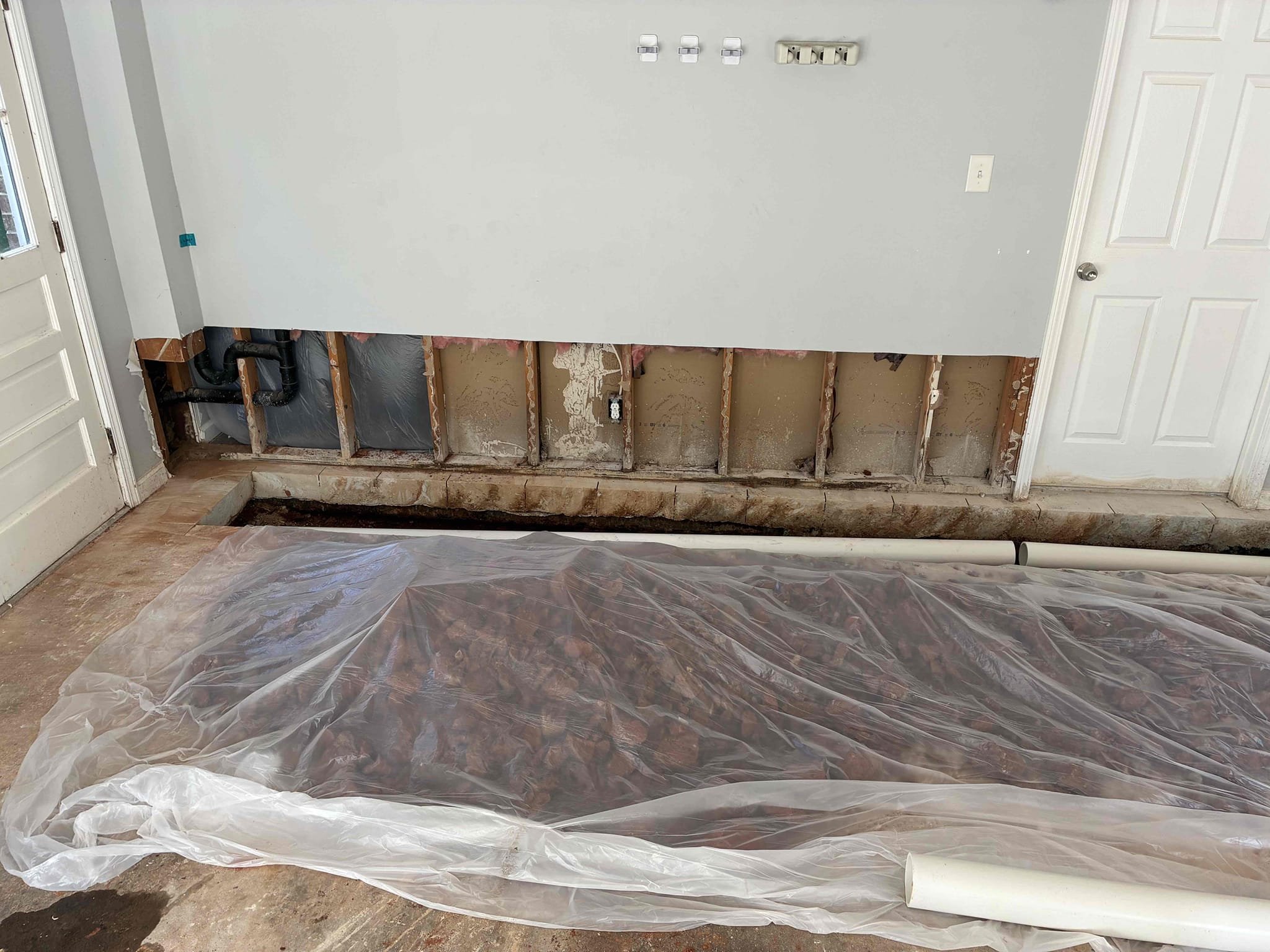Customer. had 4 inch cast-iron under slab causing frequent stoppages. decided to redirect line through garage and tie back to existing line in crawlspace. Added clean out T in crawlspace. Had saw cut for concrete in garage. Put back dirt to correct level for concrete. approximately 30 foot of 4 inch PVC after install was done ran water in all areas of the house to check for proper function and leaks