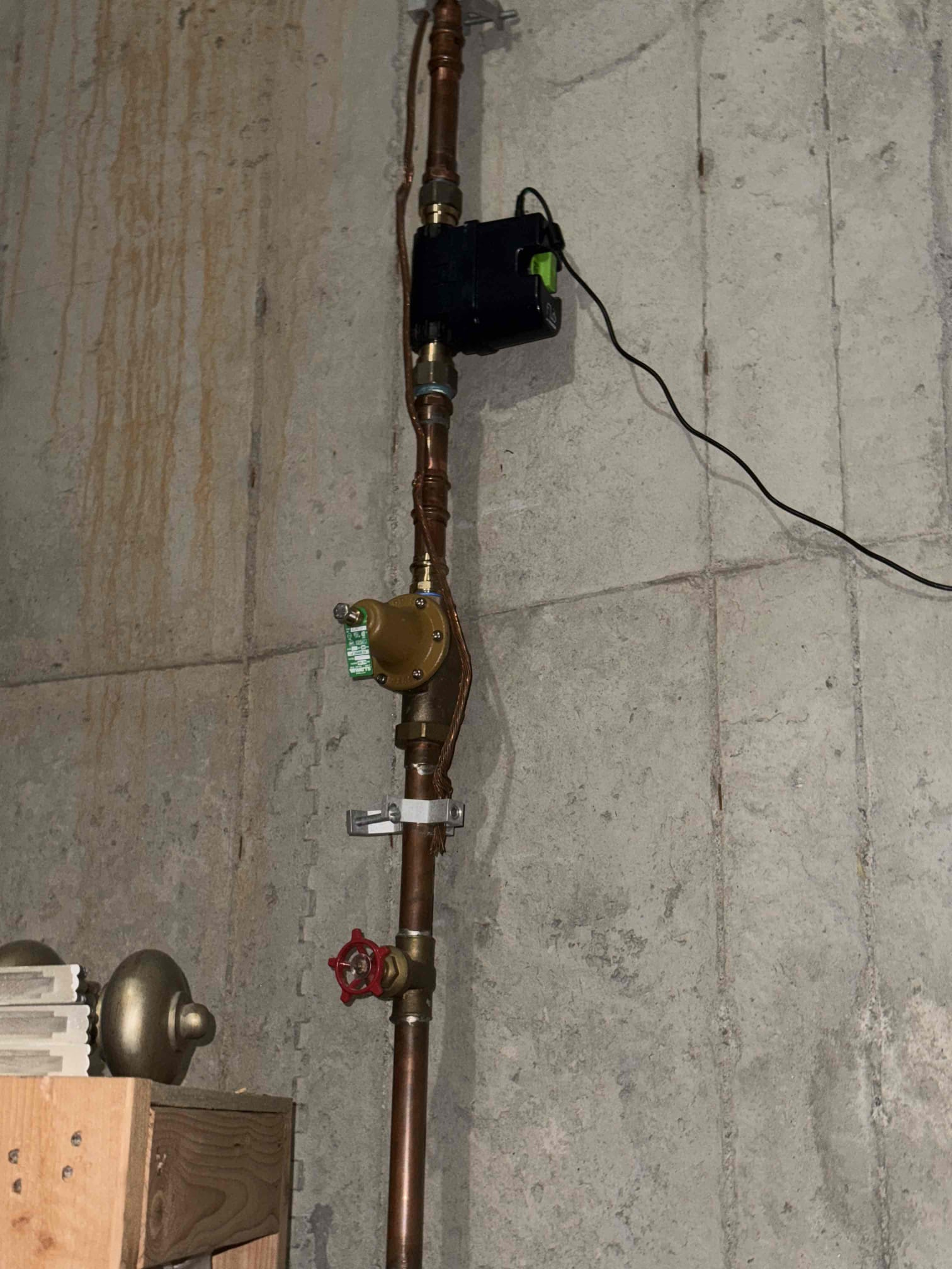 Homeowner states that she was using the secondary faucet closet to the gas stove and later in the evening she went to the basement and noticed water dripping from the ceiling light fixture and called us. When I arrived homeowner greeted me and showed me the basement area where the ceiling was leaking and it was dry no water marks or anything. I did my inspection since the shut off and GWH are located in basement. I checked the pressure and it was normal at the time but the homeowner has a Flo by Moen and she states she got notifications that the water pressure was to high or to low and it was constantly and they have lived here since 07-08 and hadn’t had a PRV replaced so I recommended replacing it with two PRVs which would help them last a lot longer then just one. We went back to the kitchen and I used the secondary faucet and opened the cabinets and I could see water dripping when the faucet was in use then I pulled out the sprayer and the hose was punctured which caused the leak. H