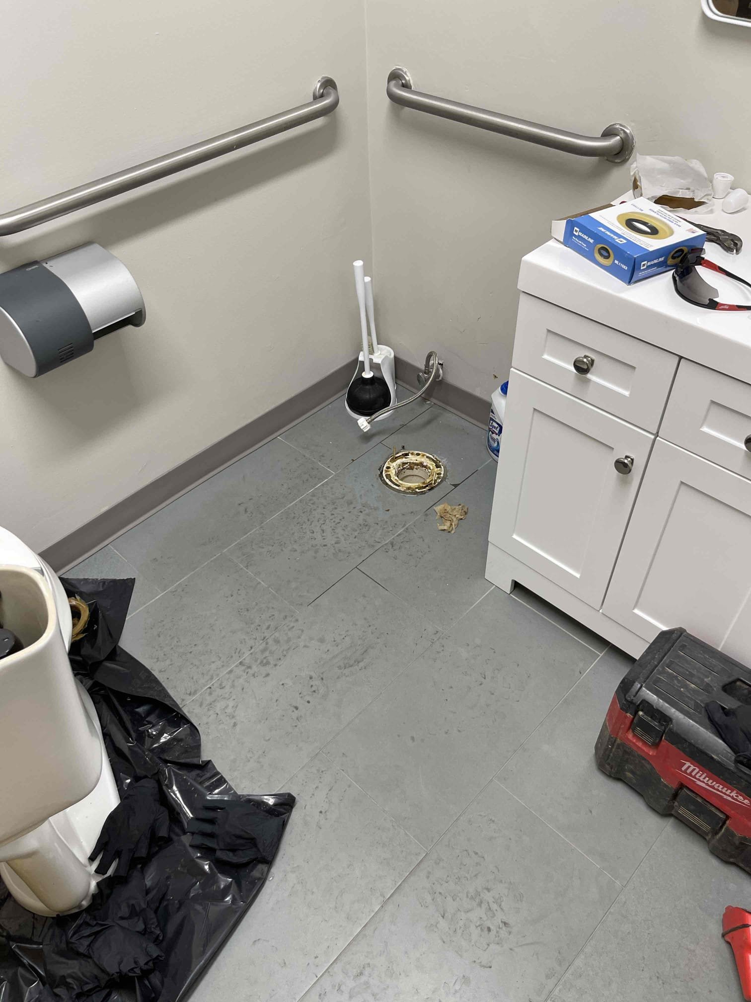 Came out for sewer back up in suite D. Pulled toilet in women’s room. Ran snake down to blockage and cleared blockage at distance of 25’. Camera’d section where blockage occurred and found a mound of cured concrete that felt down into the pipe when the concrete was being poured back. There’s a dicey visible in the concrete where it sunk down into the pipe. Camera’d down past the concrete to the main line services multiple warehouses/suites. Made it 130’ down the main line, Sewer line was installed completely flat during construction, and due to settling the pipe now has multiple bellies/low spots that are constantly holding water and causing reoccurring back ups. Bellies holding 2”+ of water at all times. Left quote to repair section of drain affecting bathrooms for suite D and remove the section of drain with concrete in it. Quote to replace mainline affecting multiple suites will require more in-depth camera diagnostic work in each building to locate all of the drains and create an a Came out for sewer back up in suite D. Pulled toilet in women’s room. Ran snake down to blockage and cleared blockage at distance of 25’. Camera’d section where blockage occurred and found a mound of cured concrete that felt down into the pipe when the concrete was being poured back. There’s a dicey visible in the concrete where it sunk down into the pipe. Camera’d down past the concrete to the main line services multiple warehouses/suites. Made it 130’ down the main line, Sewer line was installed completely flat during construction, and due to settling the pipe now has multiple bellies/low spots that are constantly holding water and causing reoccurring back ups. Bellies holding 2”+ of water at all times. Left quote to repair section of drain affecting bathrooms for suite D and remove the section of drain with concrete in it. Quote to replace mainline affecting multiple suites will require more in-depth camera diagnostic work in each building to locate all of the drains and create an a